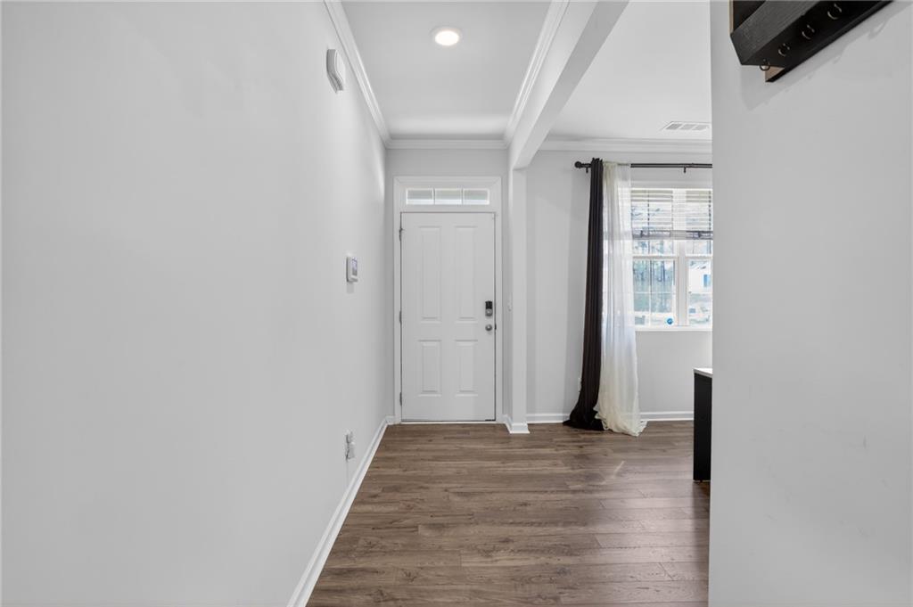930 Sly Fox Run Fairburn, GA 30213 - Photo 4 of 28 a view of a room with wooden floor and a window