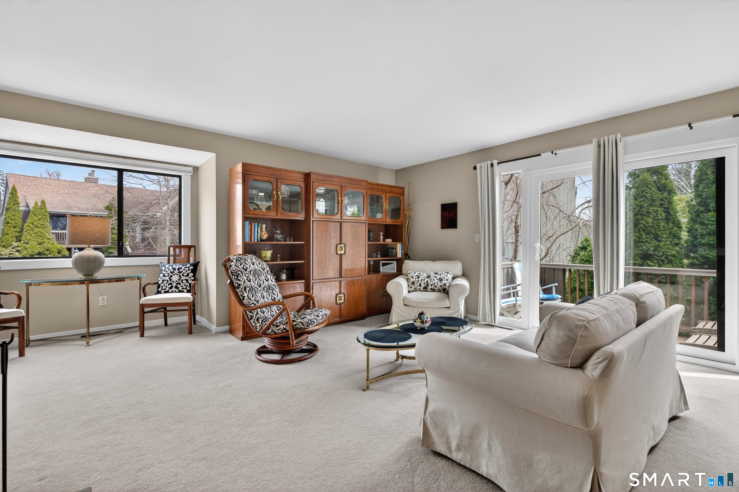 196 Apache Lane, Unit A Stratford, CT 06614 - Photo 11 of 40 a living room with furniture and a large window
