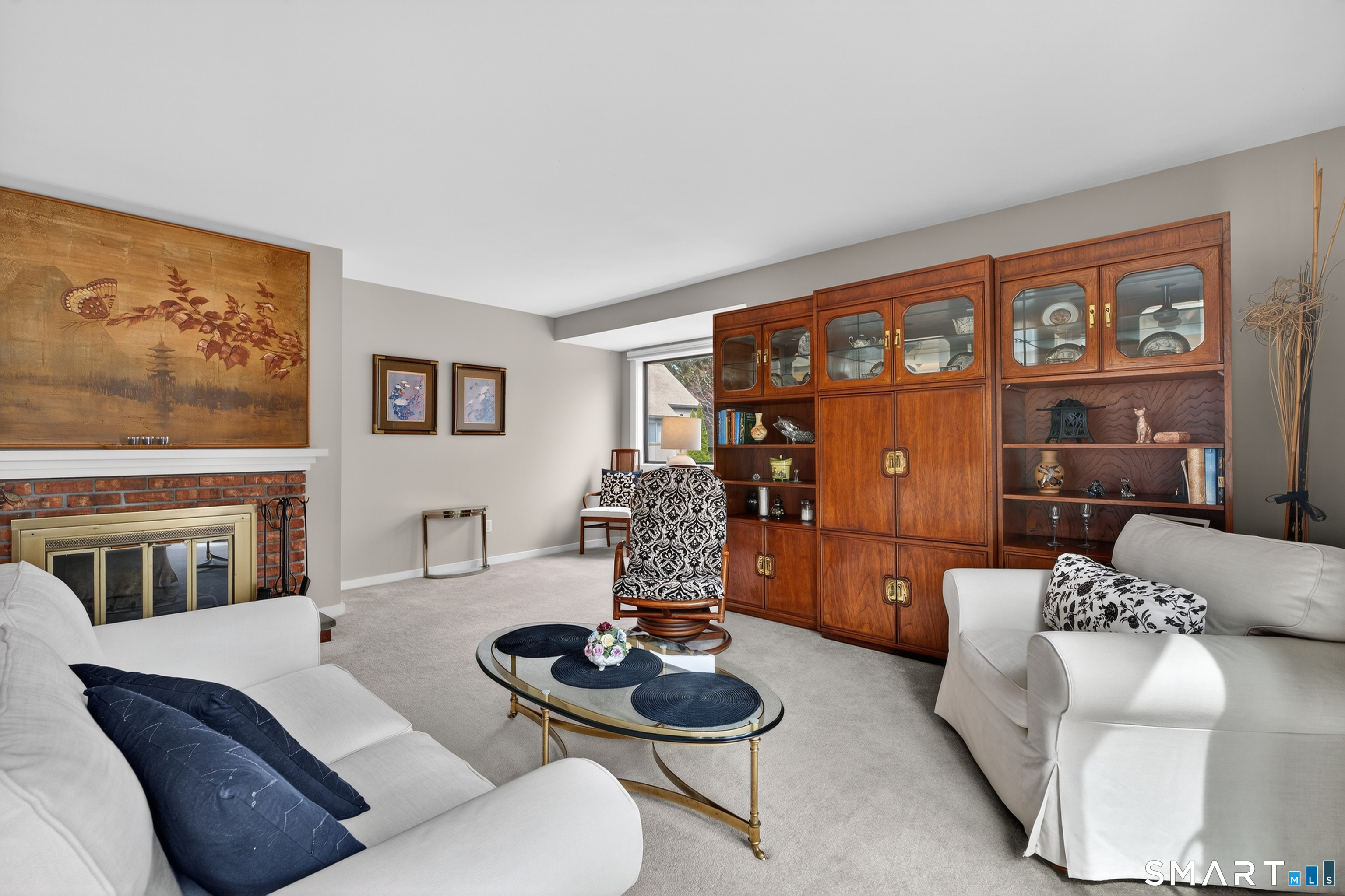 196 Apache Lane, Unit A Stratford, CT 06614 - Photo 12 of 40 a living room with furniture and a fireplace