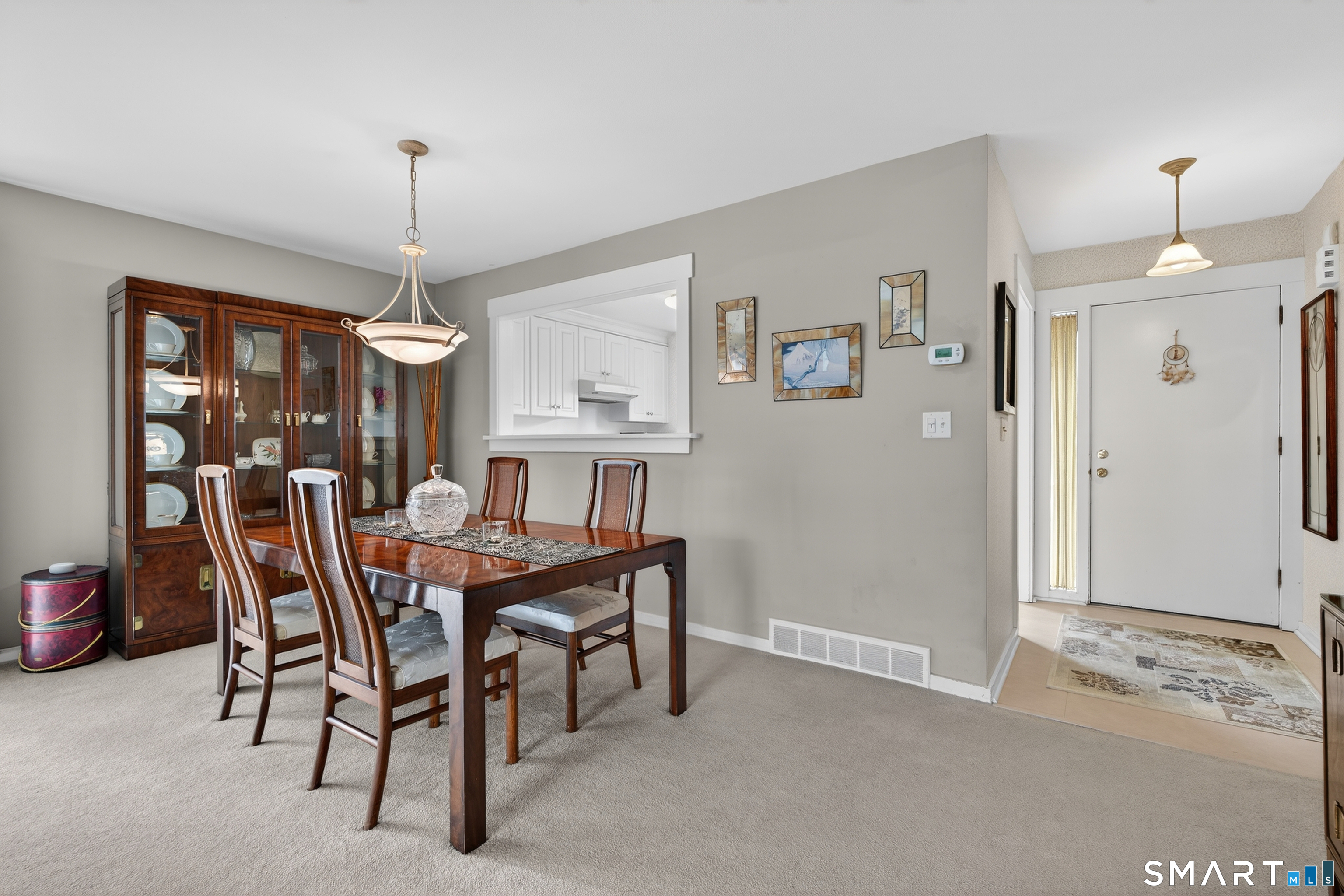 196 Apache Lane, Unit A Stratford, CT 06614 - Photo 17 of 40 a view of a dining room with furniture window and wooden floor
