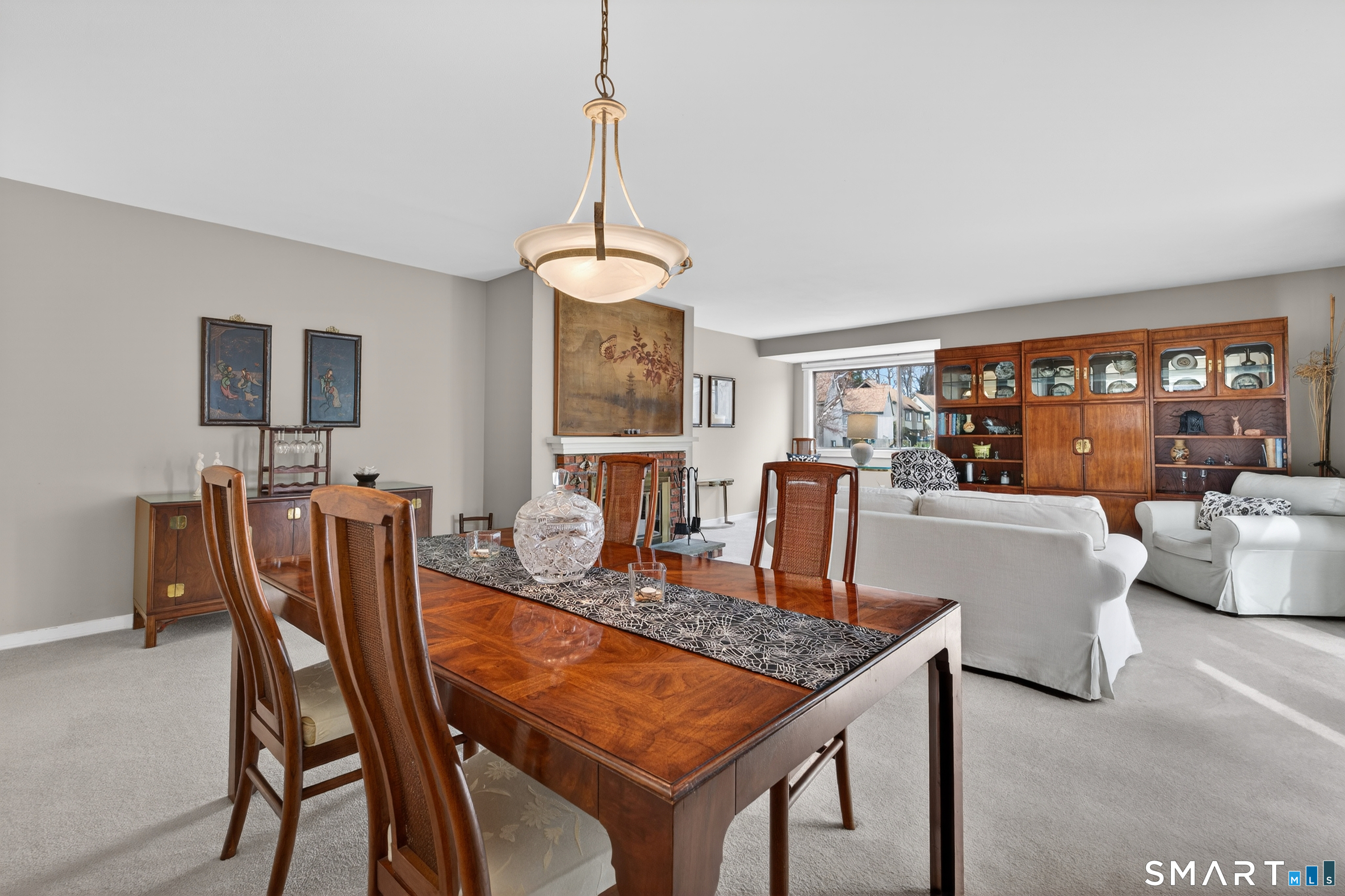 196 Apache Lane, Unit A Stratford, CT 06614 - Photo 18 of 40 a dining room with furniture a chandelier and window