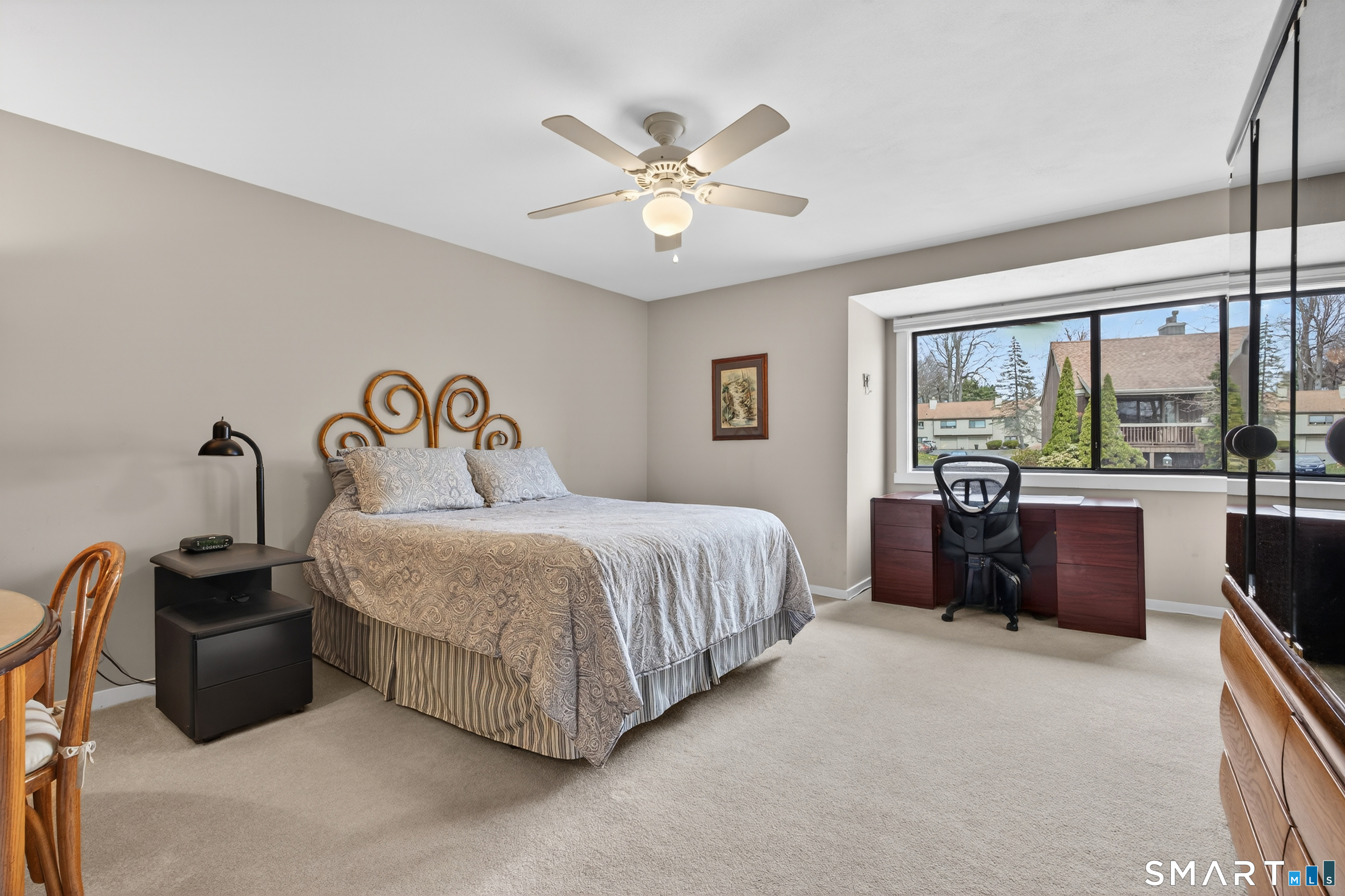 196 Apache Lane, Unit A Stratford, CT 06614 - Photo 20 of 40 a bedroom with a bed and a large window