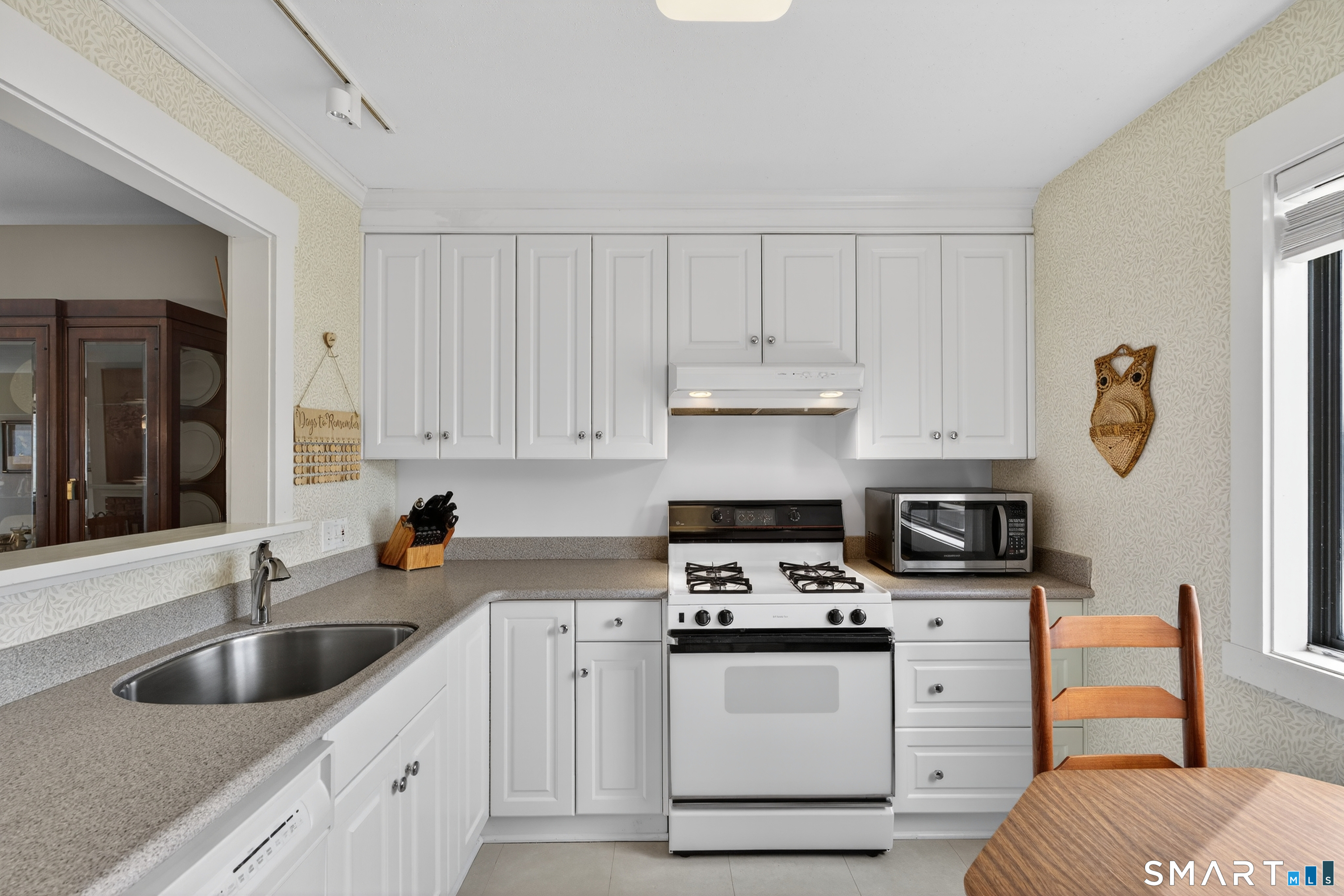196 Apache Lane, Unit A Stratford, CT 06614 - Photo 3 of 40 a kitchen with appliances a sink and cabinets