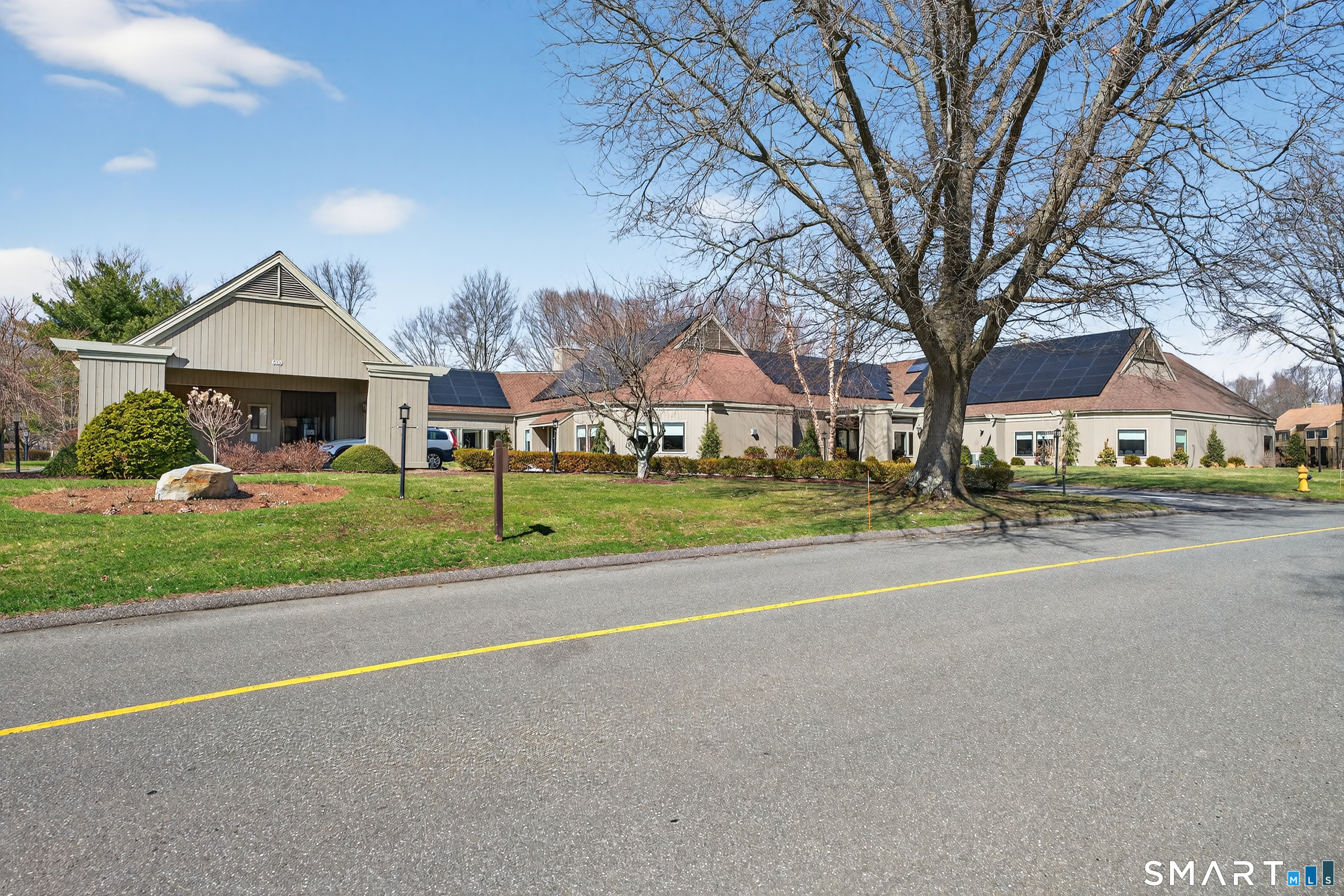 196 Apache Lane, Unit A Stratford, CT 06614 - Photo 38 of 40 a view of a house with a big yard and large trees