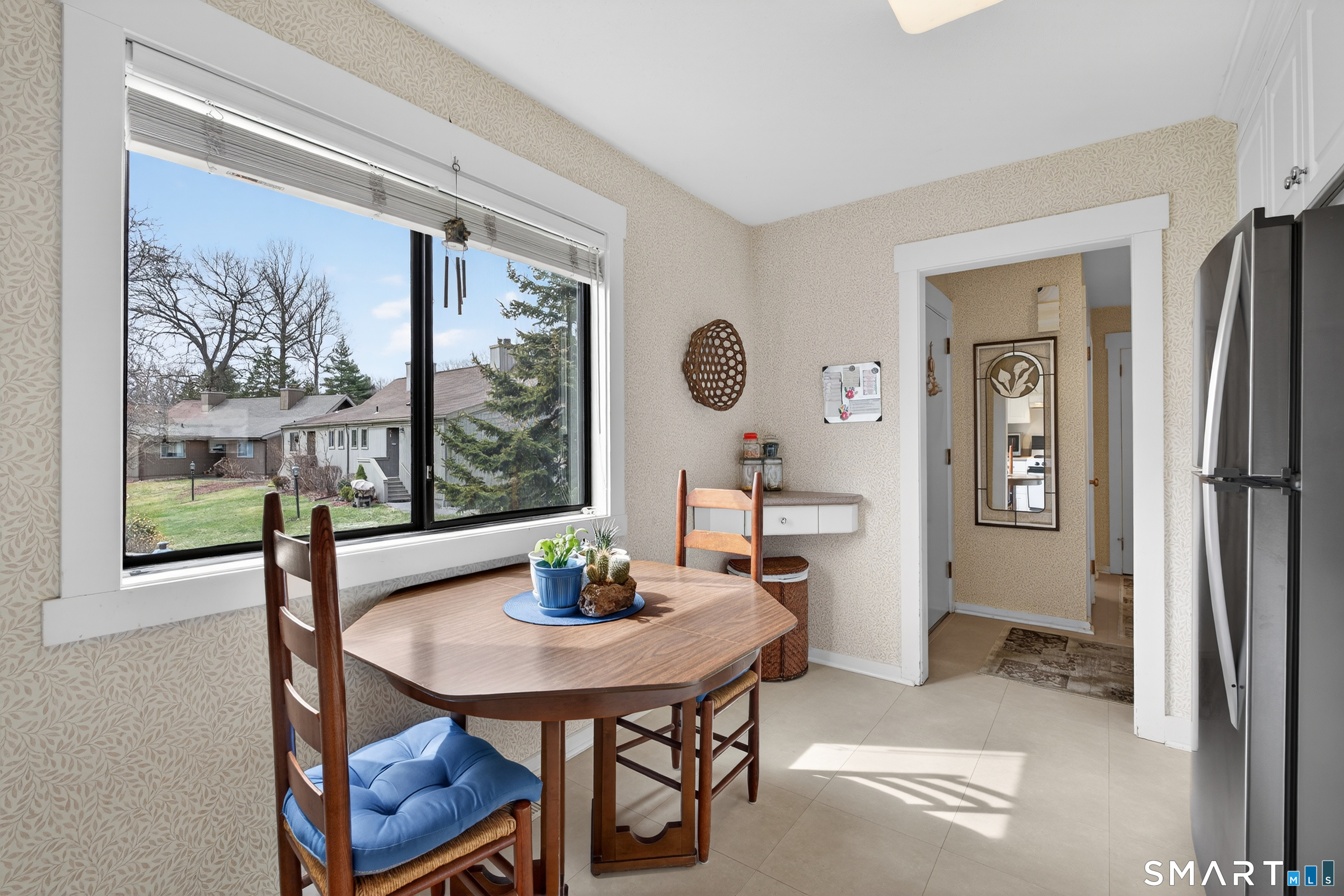 196 Apache Lane, Unit A Stratford, CT 06614 - Photo 6 of 40 a view of a dining room with furniture window and wooden floor