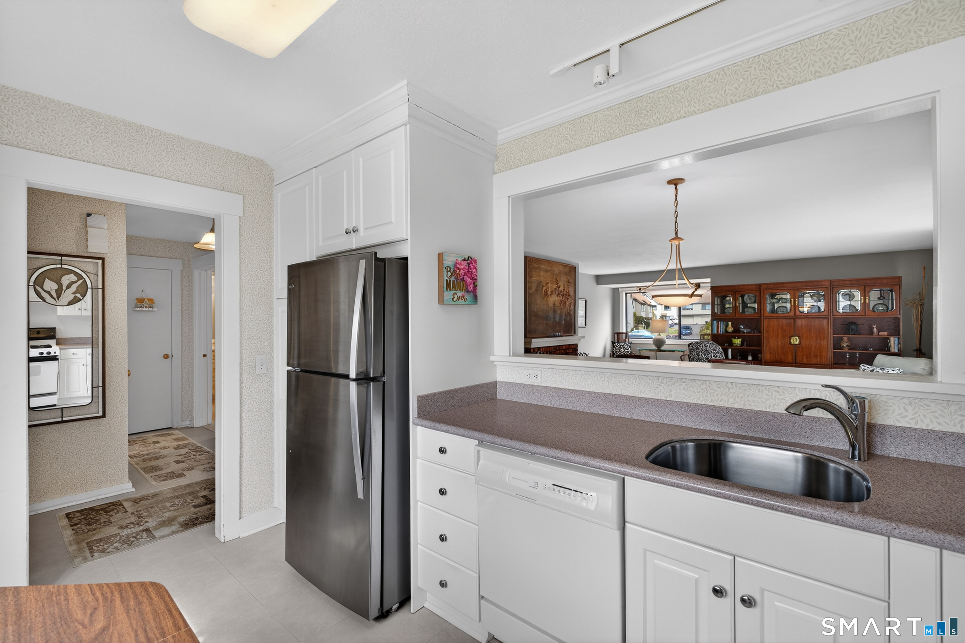 196 Apache Lane, Unit A Stratford, CT 06614 - Photo 7 of 40 a kitchen with stainless steel appliances granite countertop a refrigerator and a sink
