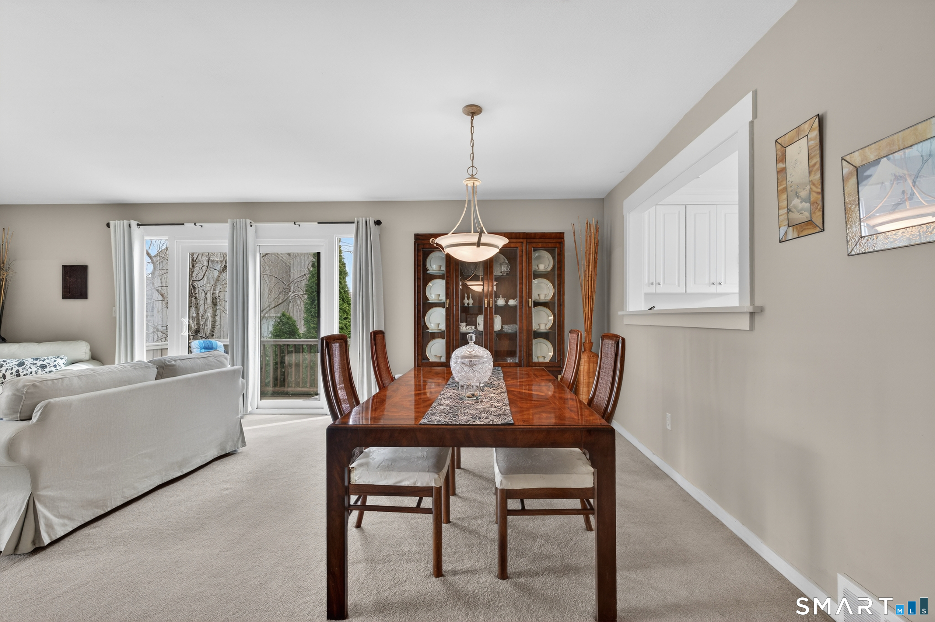196 Apache Lane, Unit A Stratford, CT 06614 - Photo 10 of 40 a dining room with furniture a chandelier and window