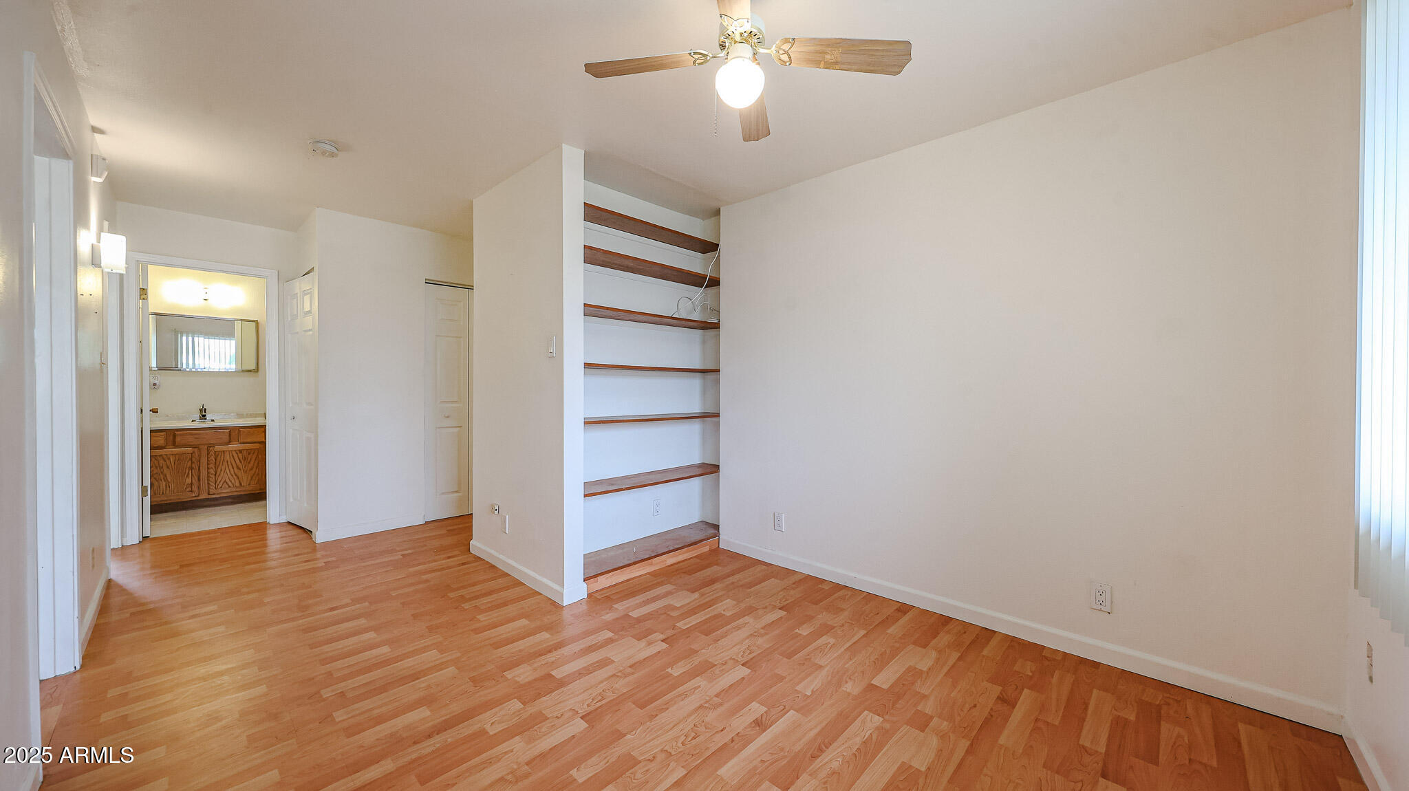 11851 North Thunderbird Road Sun City, AZ 85351 - Photo 21 of 46 a view of empty room with wooden floor