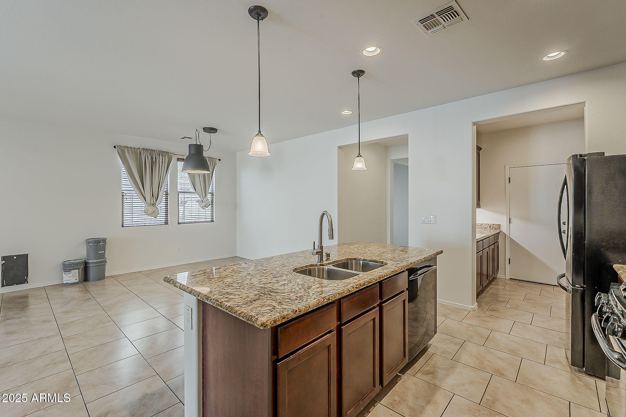 2008 East Stacey Road Gilbert, AZ 85298 - Photo 12 of 50 a kitchen with a sink a counter space and stainless steel appliances