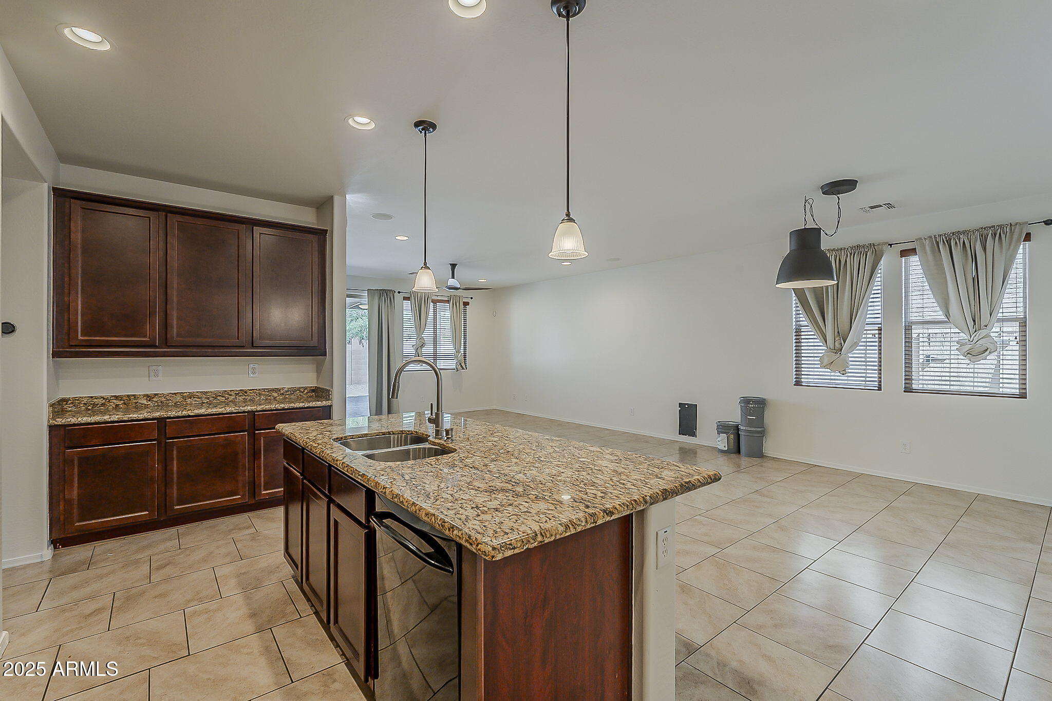 2008 East Stacey Road Gilbert, AZ 85298 - Photo 13 of 50 a kitchen with stainless steel appliances granite countertop a sink a stove and a wooden floors