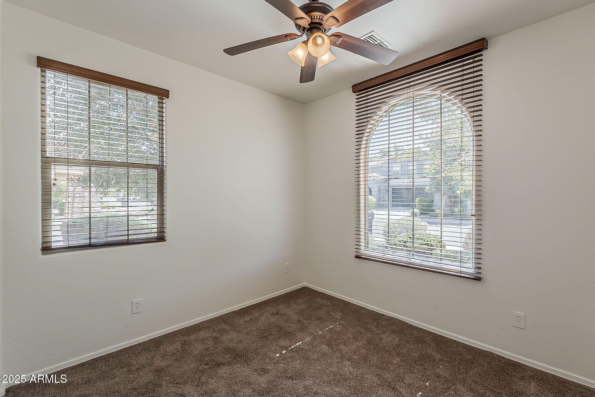 2008 East Stacey Road Gilbert, AZ 85298 - Photo 18 of 50 an empty room with a window and a fan