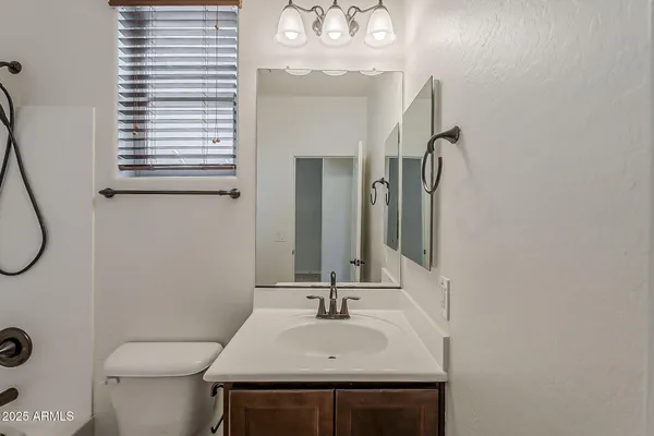 a bathroom with a bath tub with a shower
