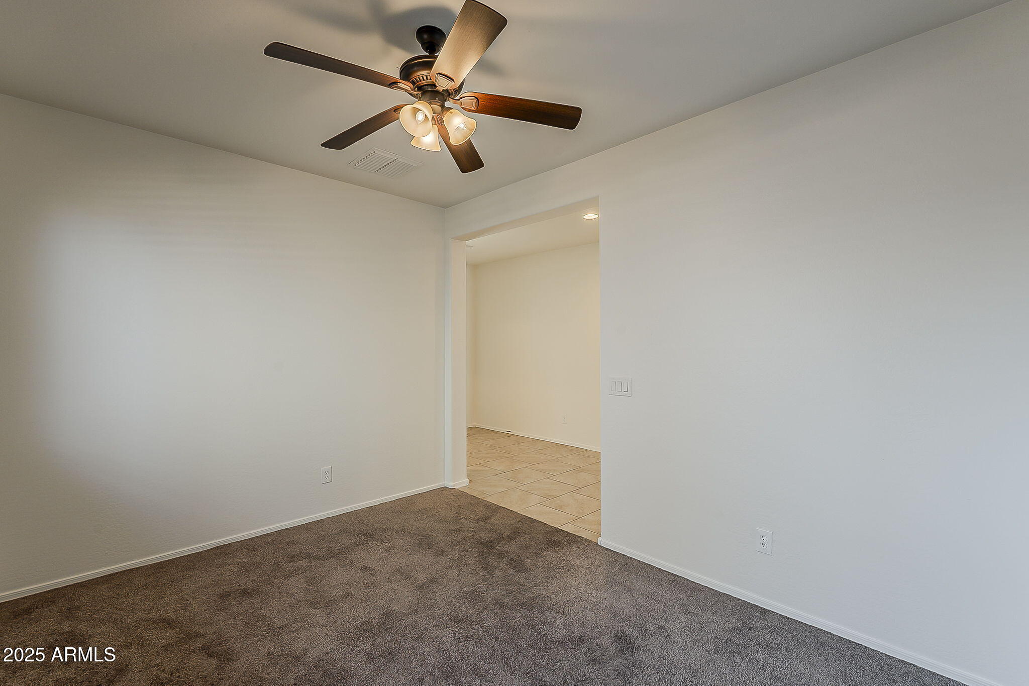2008 East Stacey Road Gilbert, AZ 85298 - Photo 24 of 50 an empty room with a ceiling fan and a fan
