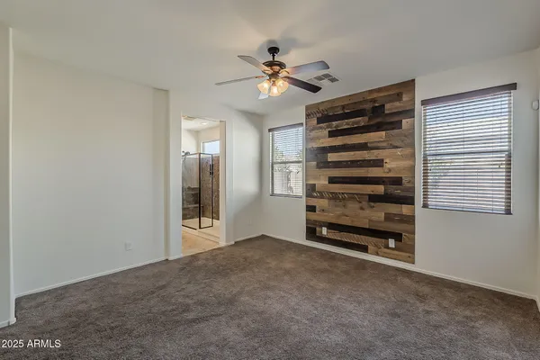 a view of a livingroom with a ceiling fan