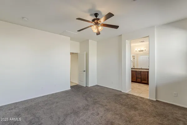 a view of a room with a ceiling fan
