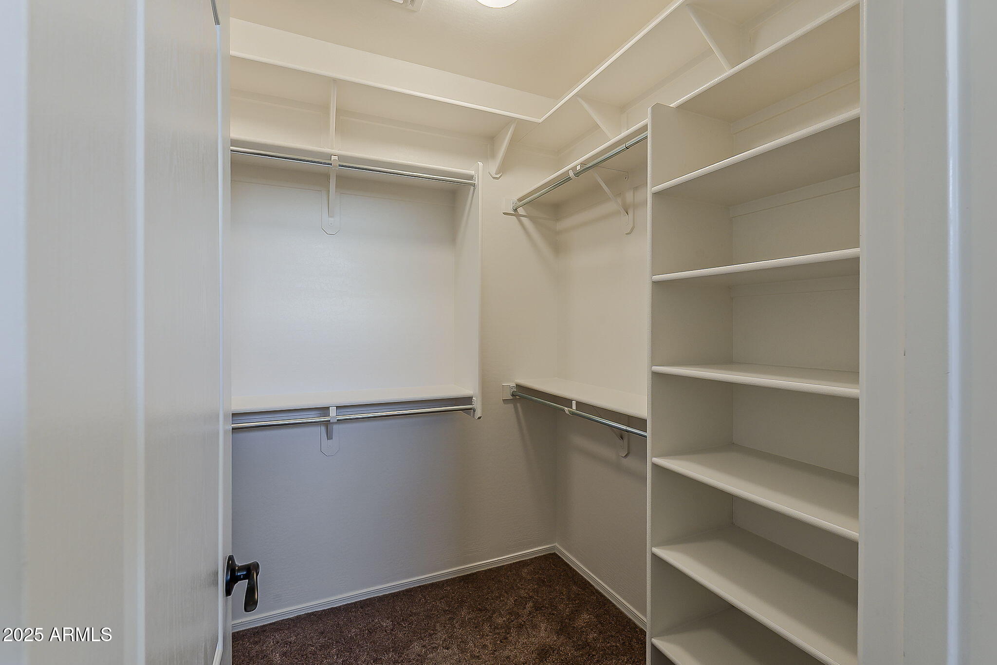 2008 East Stacey Road Gilbert, AZ 85298 - Photo 31 of 50 a view of walk in closet with empty racks