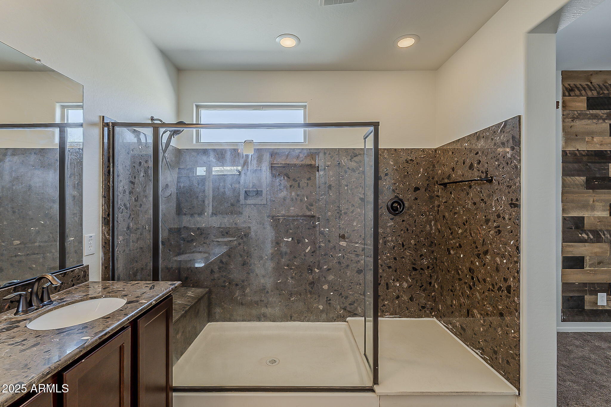 2008 East Stacey Road Gilbert, AZ 85298 - Photo 33 of 50 a bathroom with a granite countertop sink a mirror and a shower