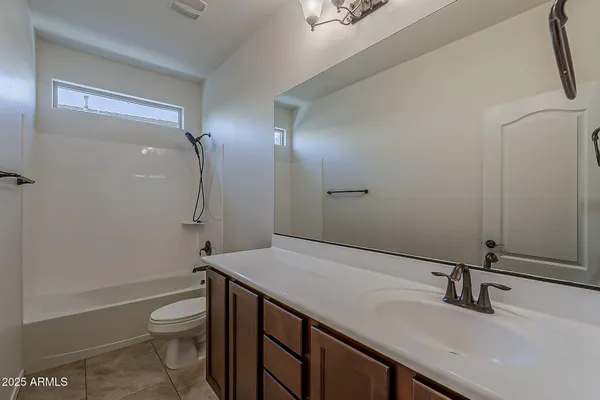 a bathroom with a shower and a toilet