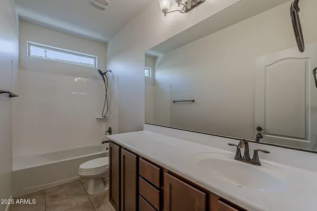 a bathroom with a shower and a toilet