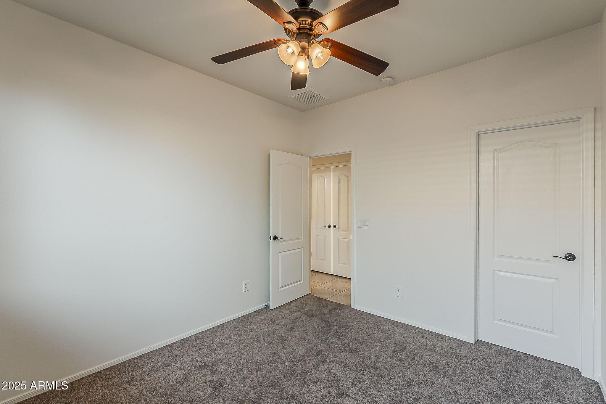 2008 East Stacey Road Gilbert, AZ 85298 - Photo 37 of 50 a view of an empty room and chandelier fan