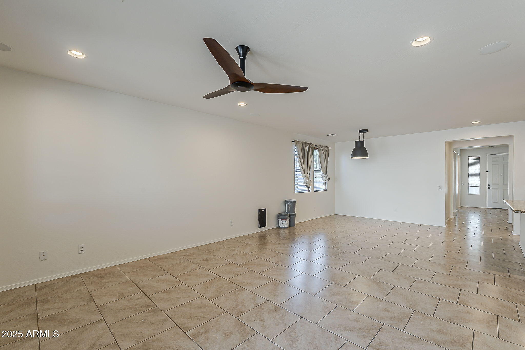 2008 East Stacey Road Gilbert, AZ 85298 - Photo 9 of 50 an empty room with windows and ceiling fan
