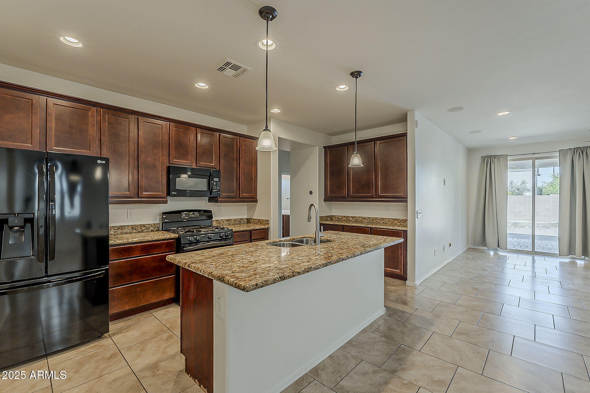 2008 East Stacey Road Gilbert, AZ 85298 - Photo 10 of 50 a kitchen with stainless steel appliances granite countertop a refrigerator a stove a sink and a oven