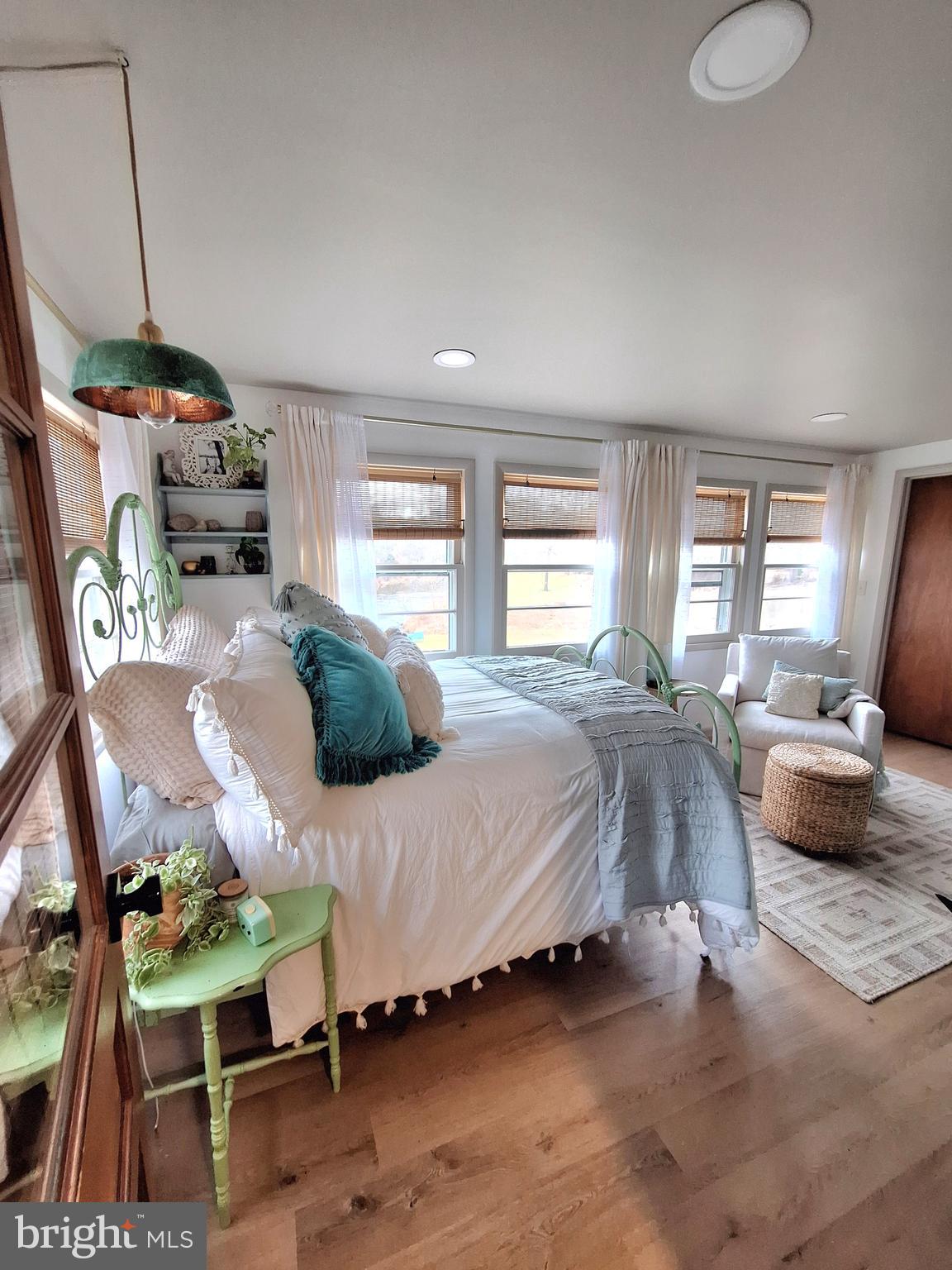 9987 Capon River Road Yellow Spring, WV 26865 - Photo 20 of 42 a bedroom with furniture and a wooden floor