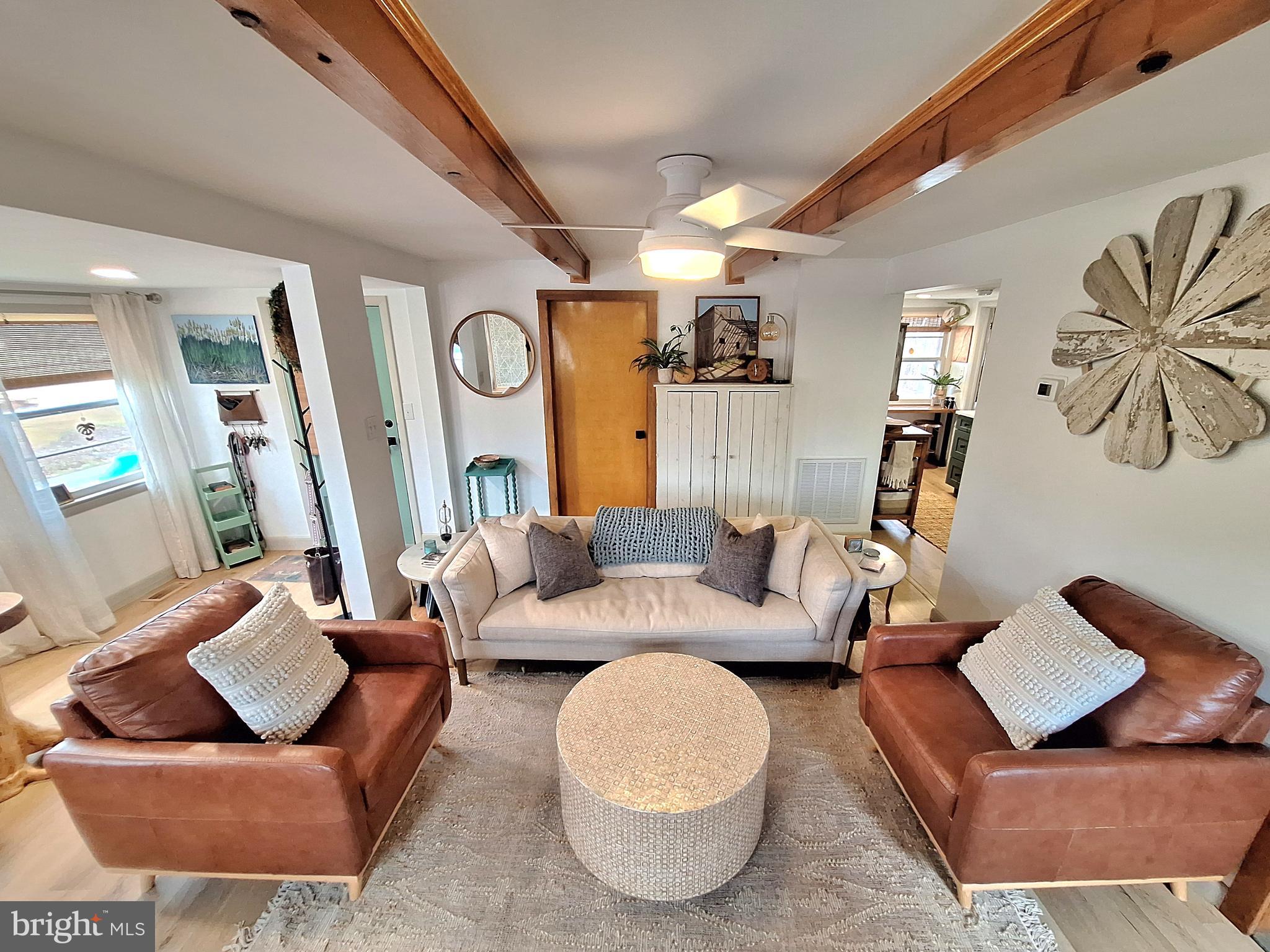 9987 Capon River Road Yellow Spring, WV 26865 - Photo 3 of 42 a living room with furniture and a large window