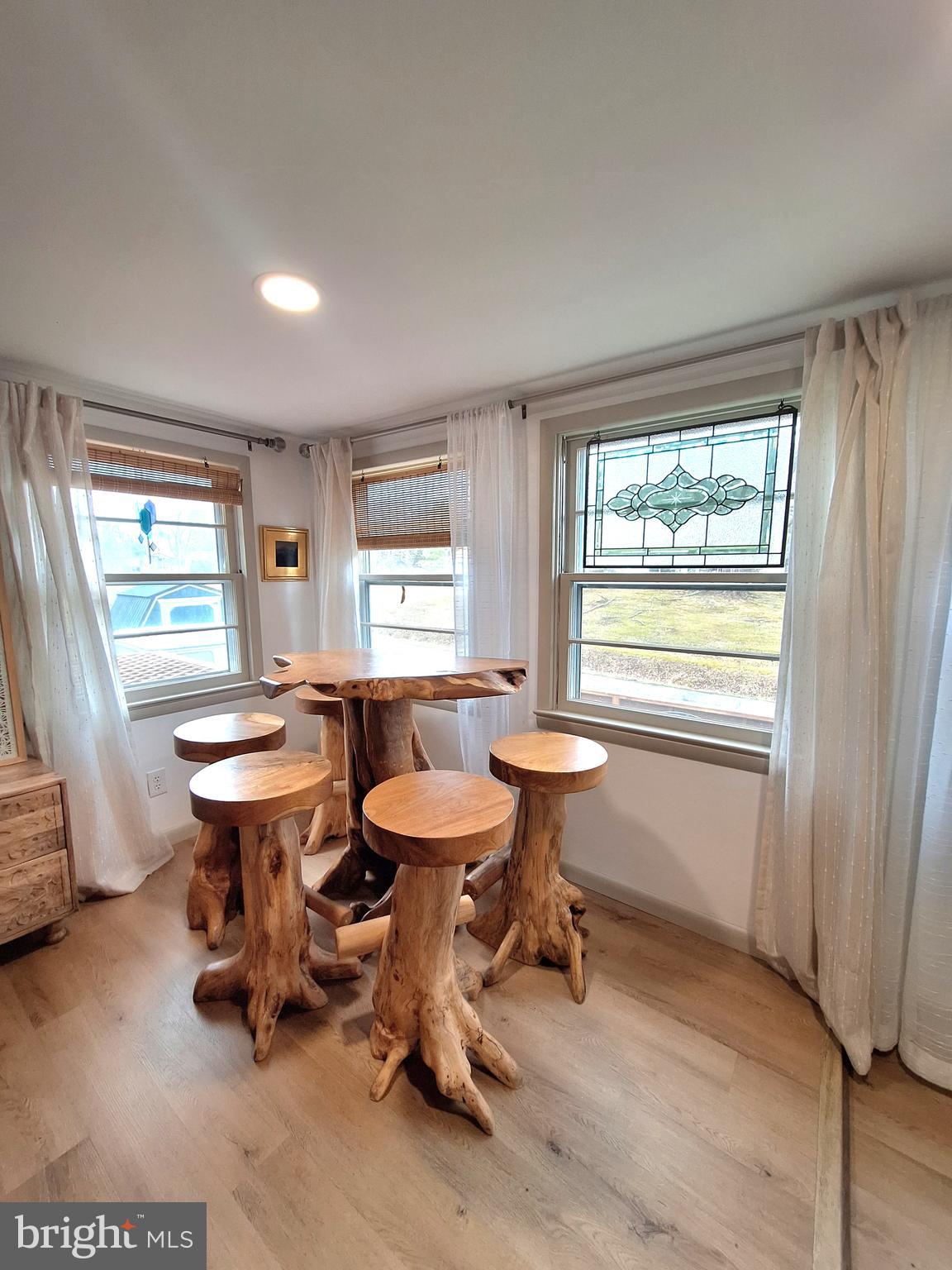 9987 Capon River Road Yellow Spring, WV 26865 - Photo 6 of 42 a room with furniture a window and a table