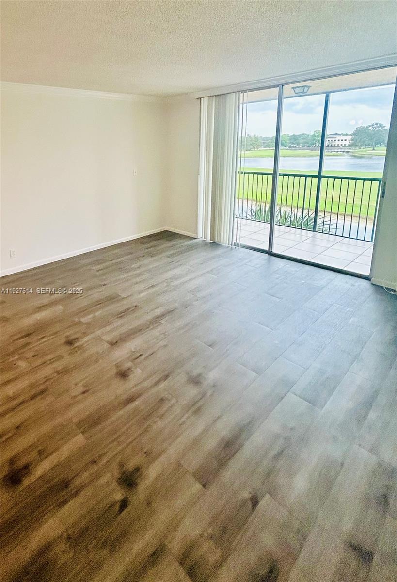 3100 West Rolling Hills Circle, Unit 310 Davie, FL 33328 - Photo 11 of 39 a view of an empty room with a window