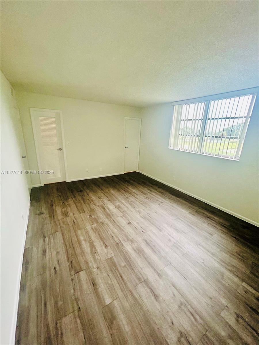 3100 West Rolling Hills Circle, Unit 310 Davie, FL 33328 - Photo 15 of 39 a view of an empty room and window
