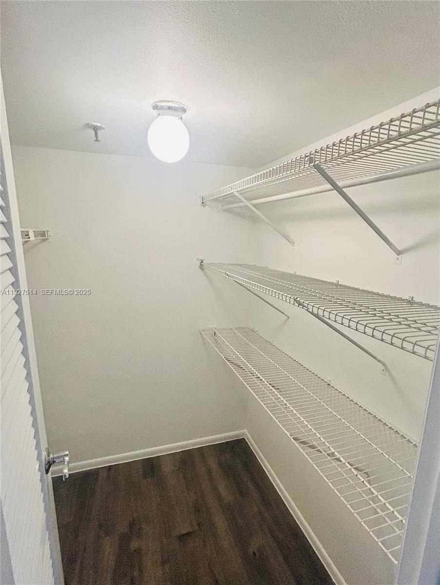 3100 West Rolling Hills Circle, Unit 310 Davie, FL 33328 - Photo 19 of 39 a view of a room with racks on the wall