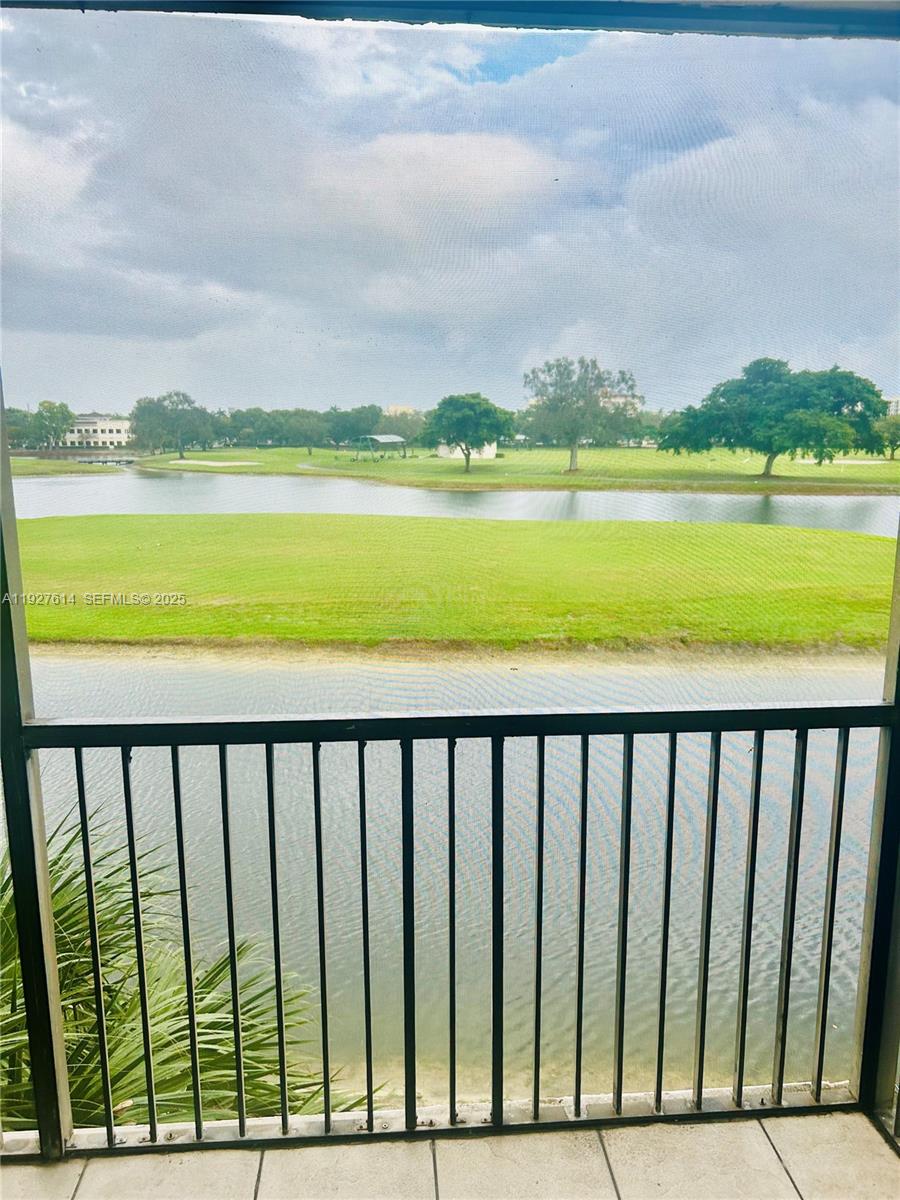 3100 West Rolling Hills Circle, Unit 310 Davie, FL 33328 - Photo 29 of 39 a view of swimming pool from a balcony