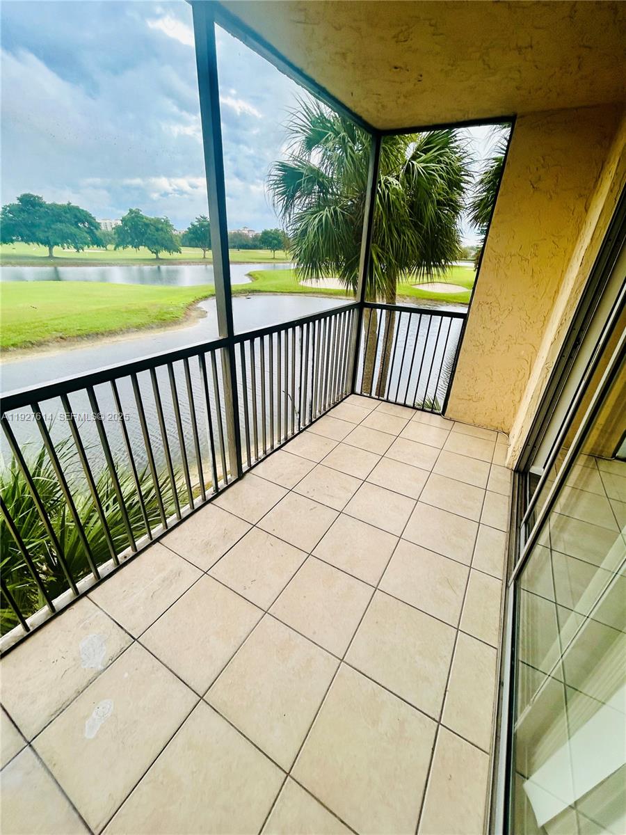 3100 West Rolling Hills Circle, Unit 310 Davie, FL 33328 - Photo 31 of 39 a balcony view with a ocean view