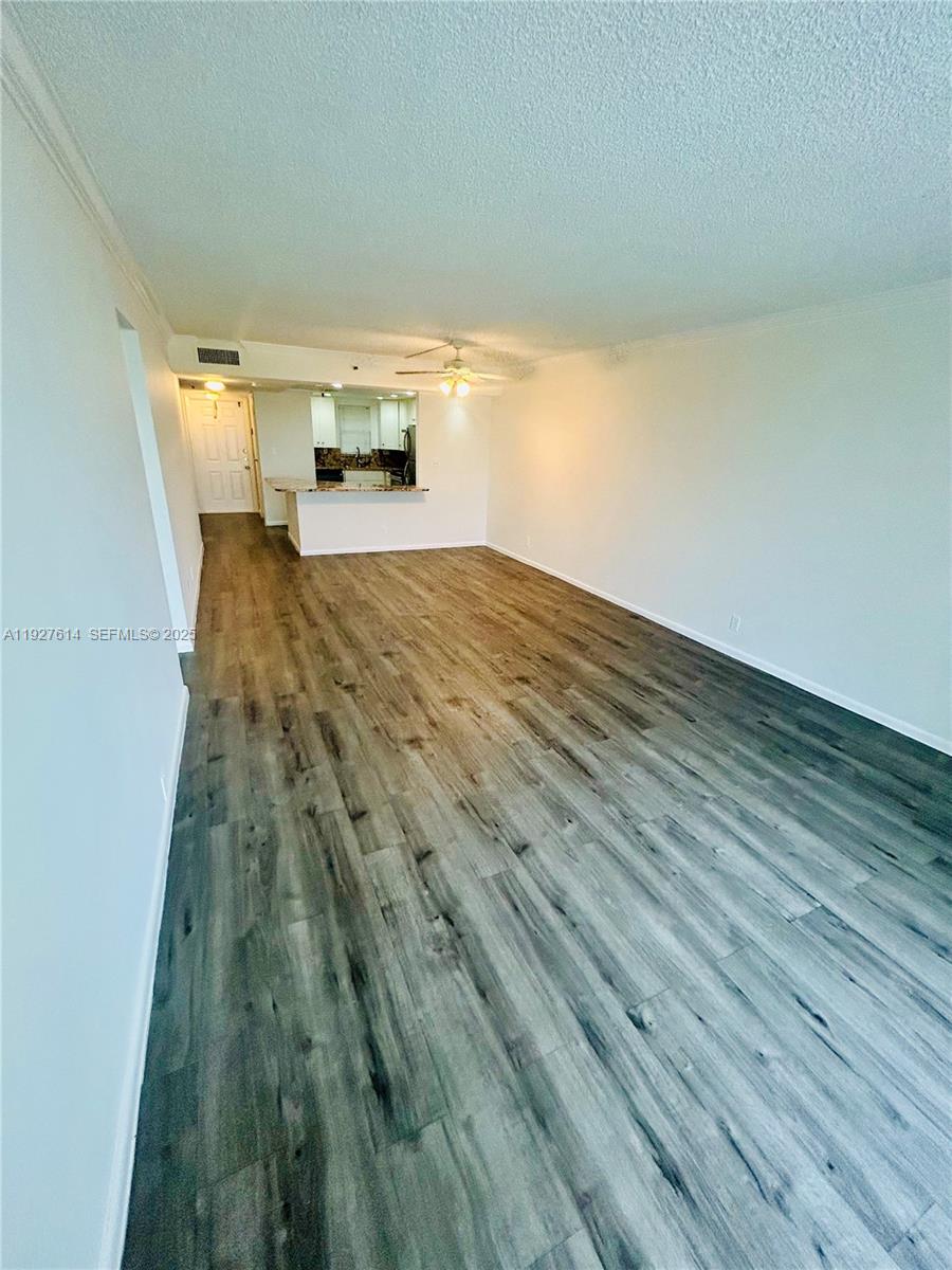 3100 West Rolling Hills Circle, Unit 310 Davie, FL 33328 - Photo 10 of 39 a view of empty room with wooden floor