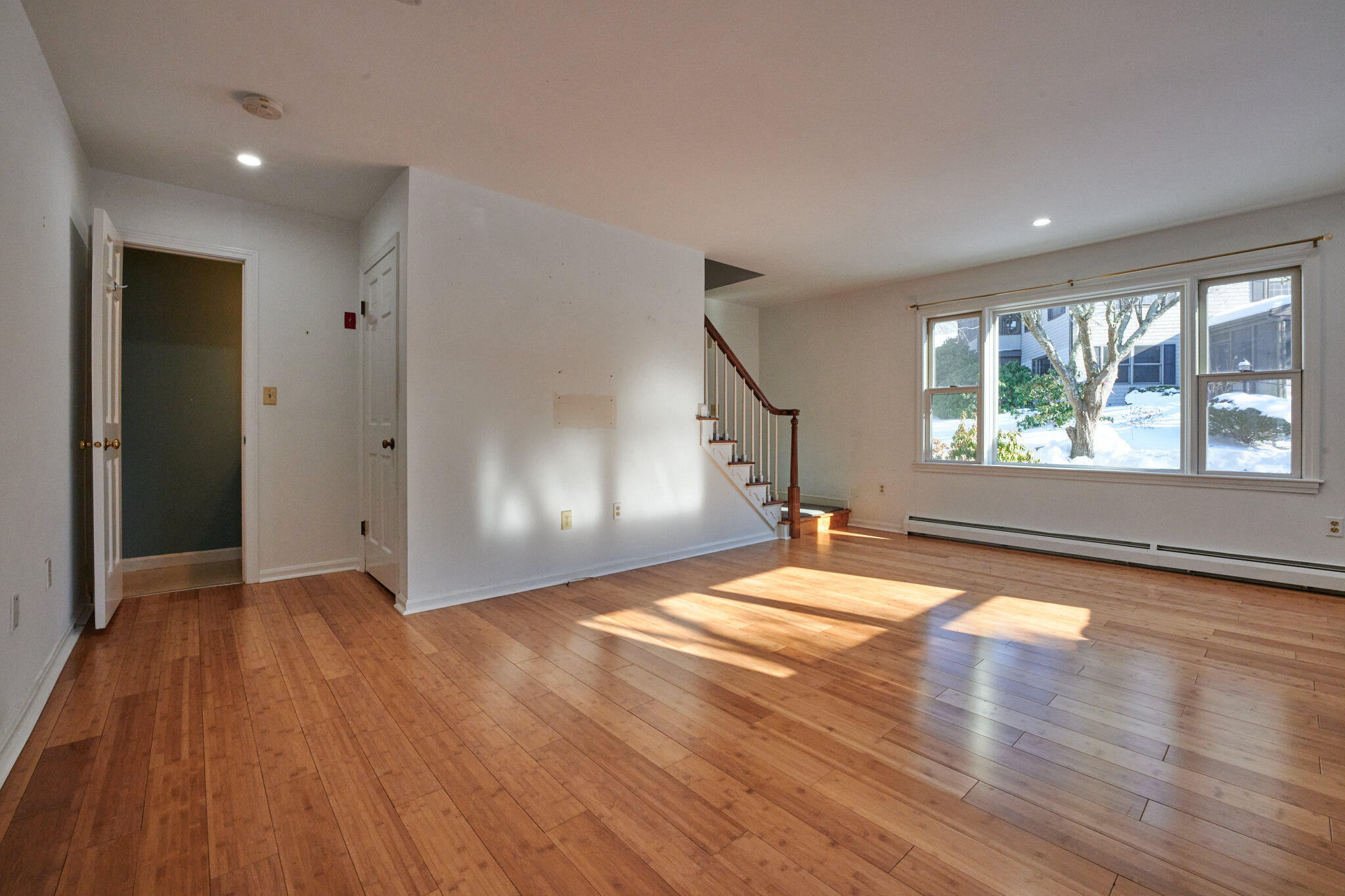 14 Harold Street, Unit 14A Harwich Port, MA 02646 - Photo 11 of 23 a view of empty room with wooden floor and fan