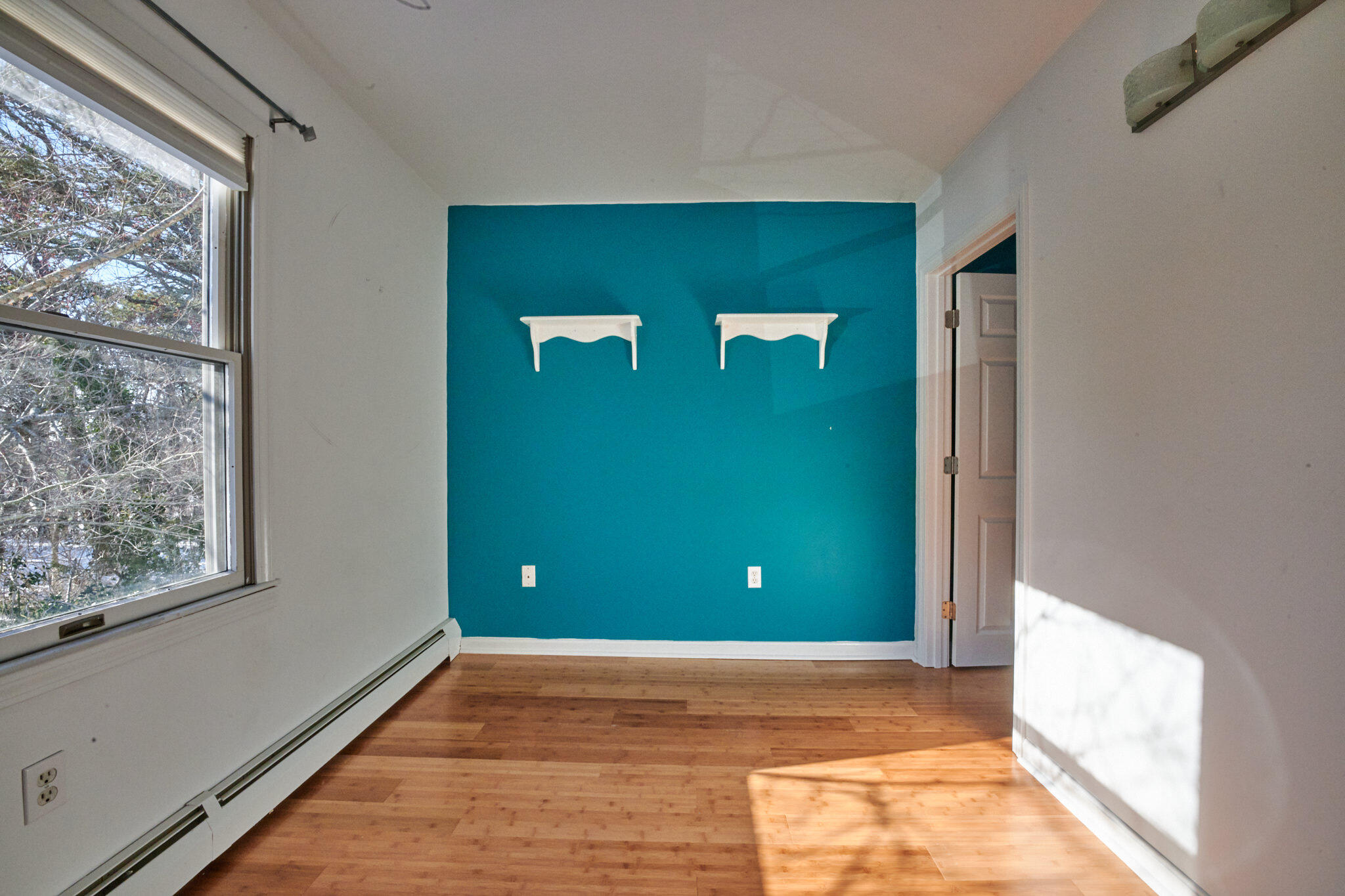 14 Harold Street, Unit 14A Harwich Port, MA 02646 - Photo 22 of 23 a view of a livingroom with a window and wooden floor
