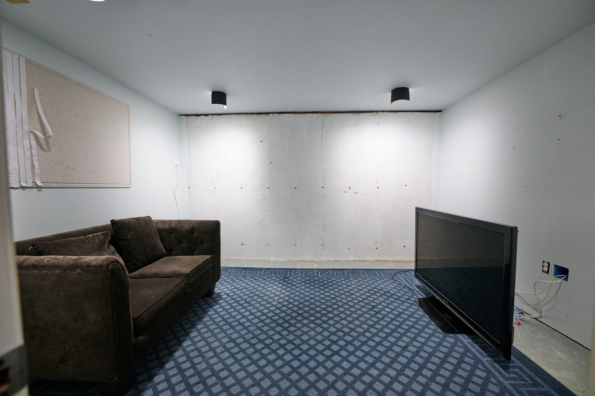 14 Harold Street, Unit 14A Harwich Port, MA 02646 - Photo 23 of 23 a living room with furniture and a flat screen tv