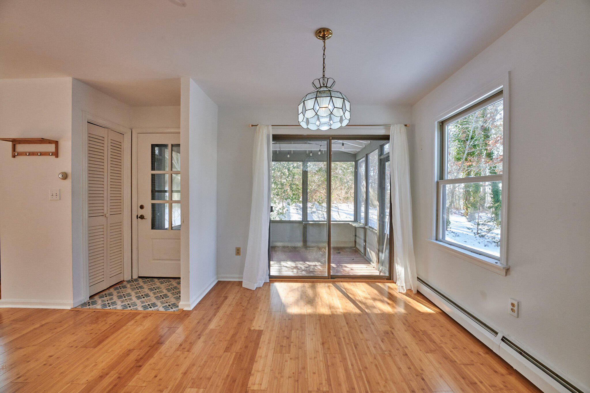 14 Harold Street, Unit 14A Harwich Port, MA 02646 - Photo 6 of 23 a view of an empty room with wooden floor and a window