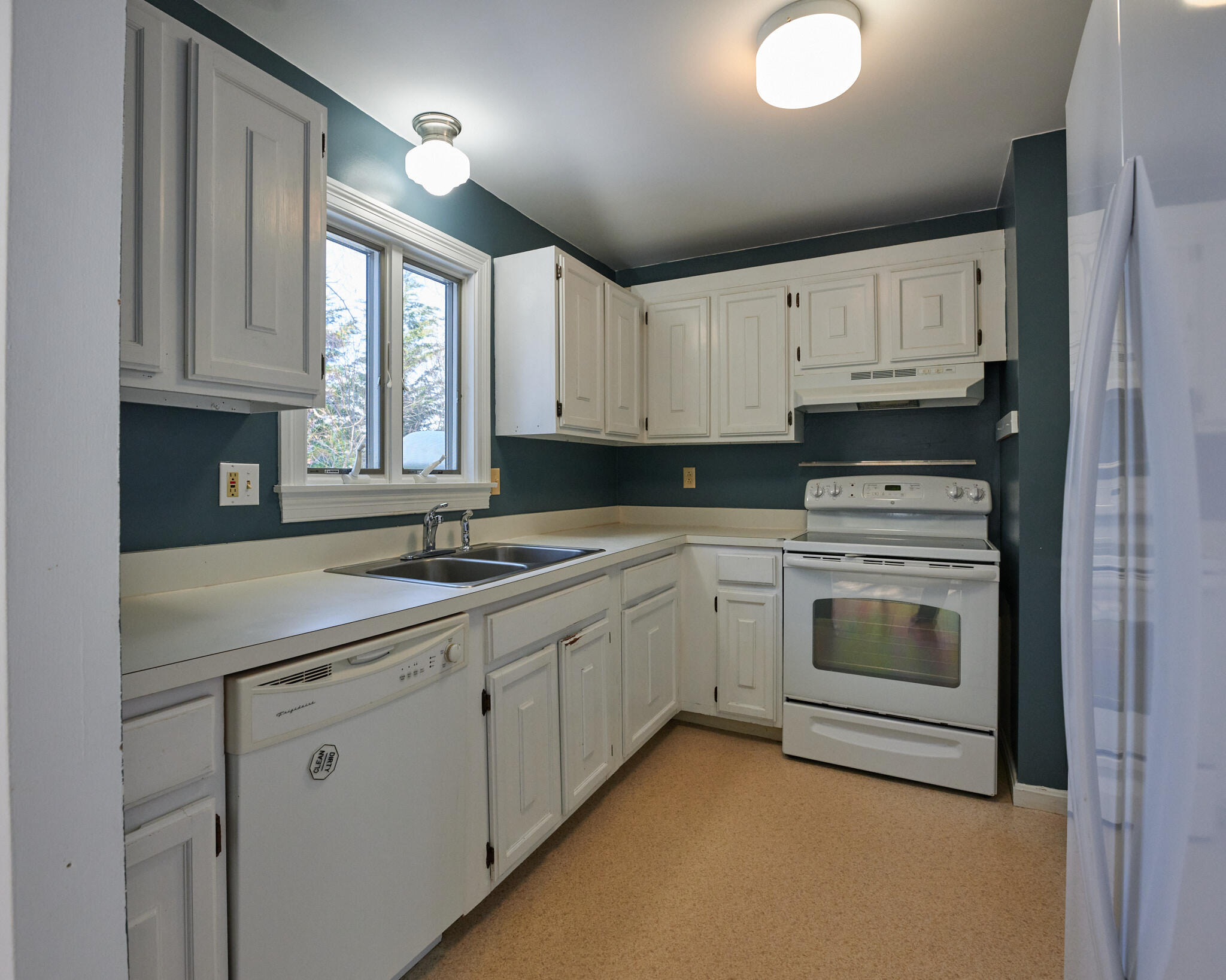 14 Harold Street, Unit 14A Harwich Port, MA 02646 - Photo 8 of 23 a kitchen with granite countertop a sink stainless steel appliances and cabinets