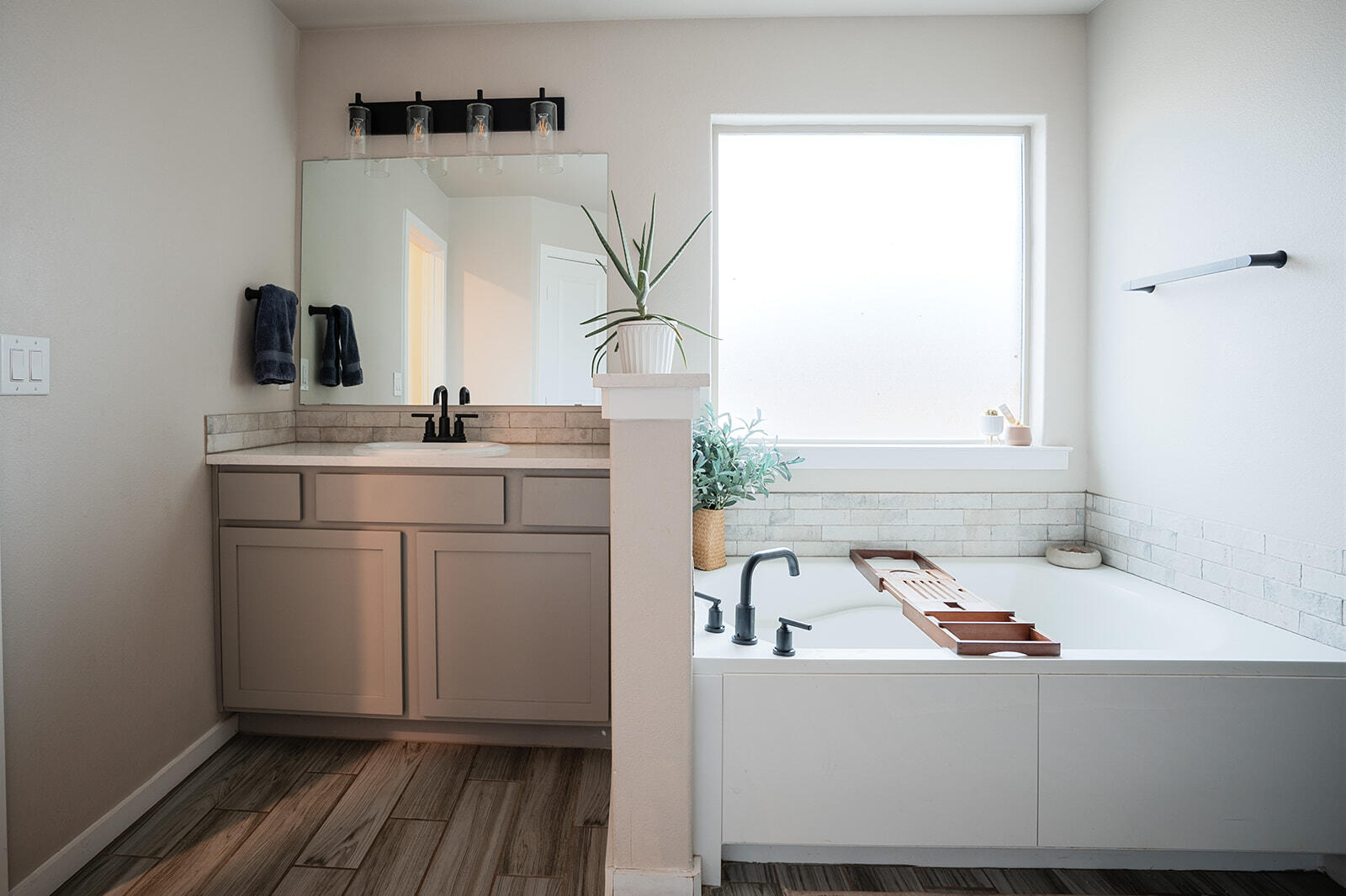 1927 142nd Street Lubbock, TX 79423 - Photo 18 of 58 a bathroom with a sink and a bathtub