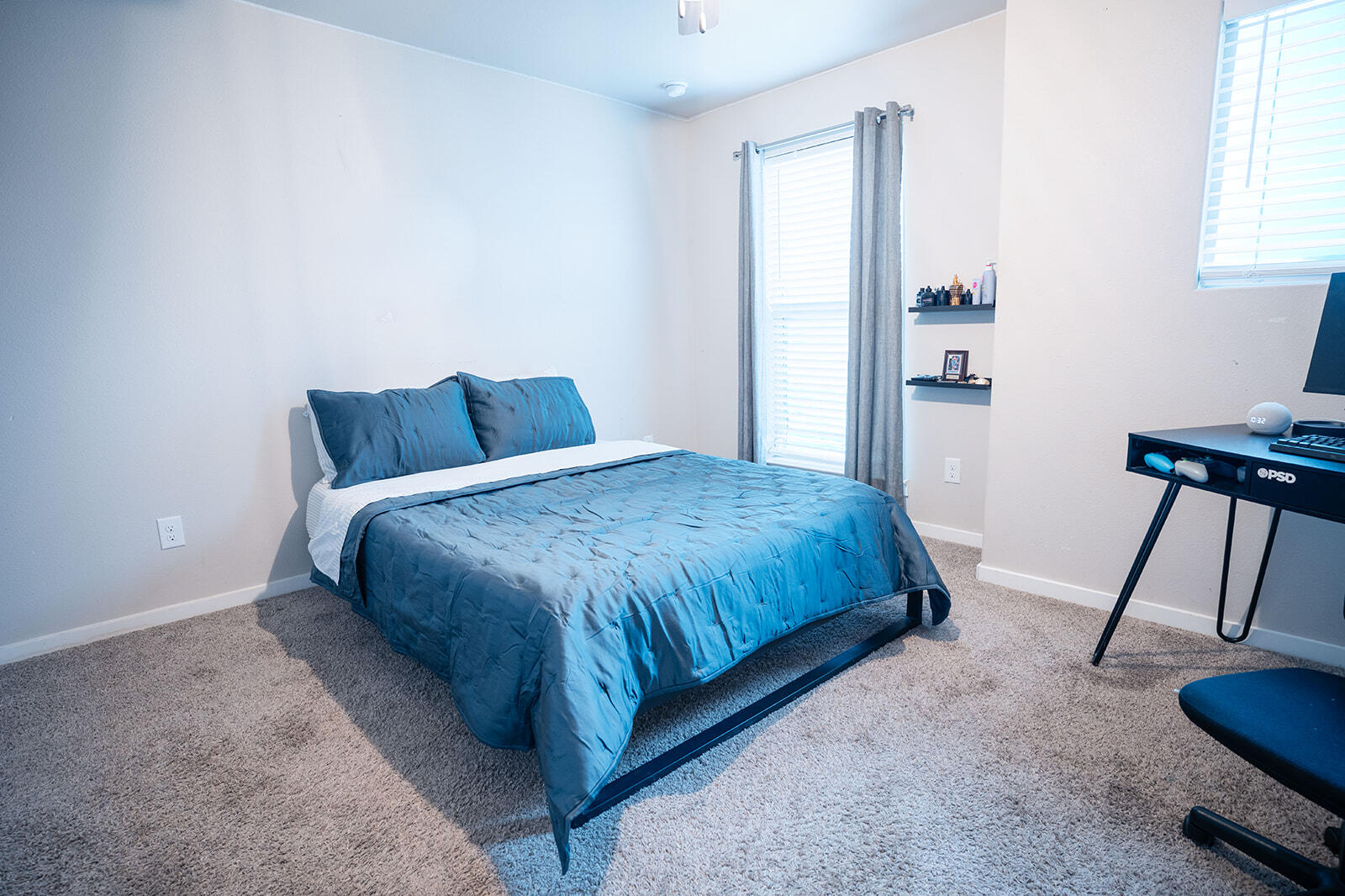1927 142nd Street Lubbock, TX 79423 - Photo 24 of 58 a bedroom with a bed a table and chair