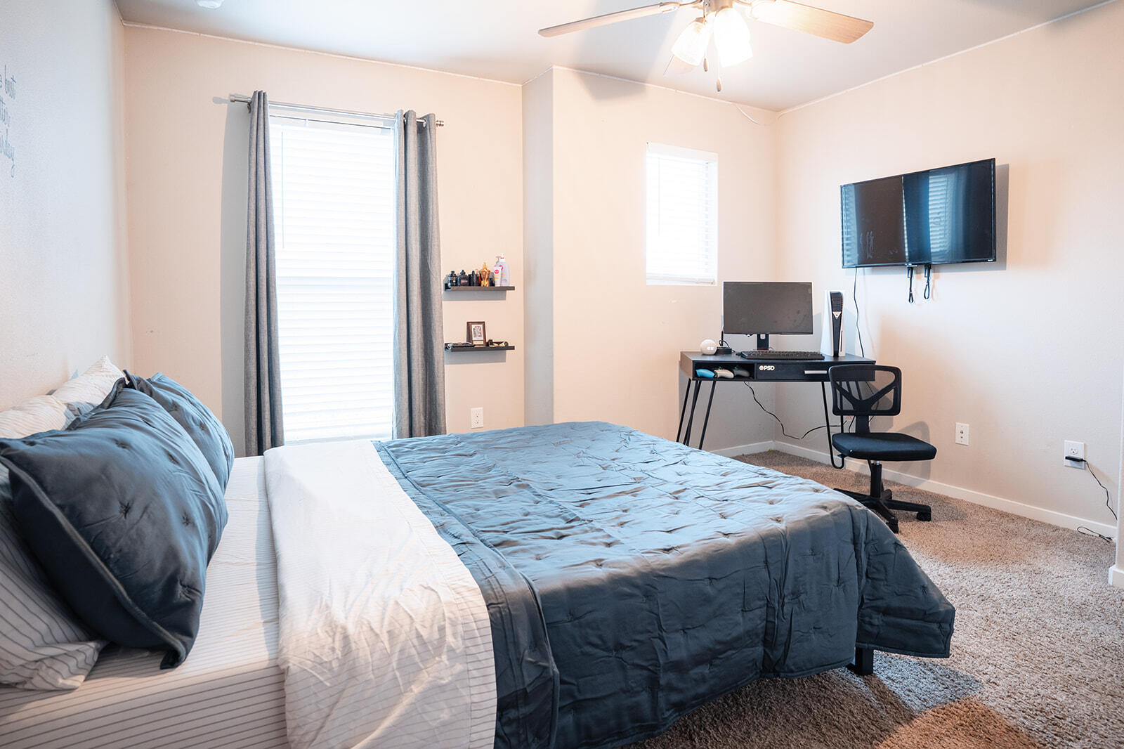 1927 142nd Street Lubbock, TX 79423 - Photo 25 of 58 a bedroom with a bed and a flat screen tv