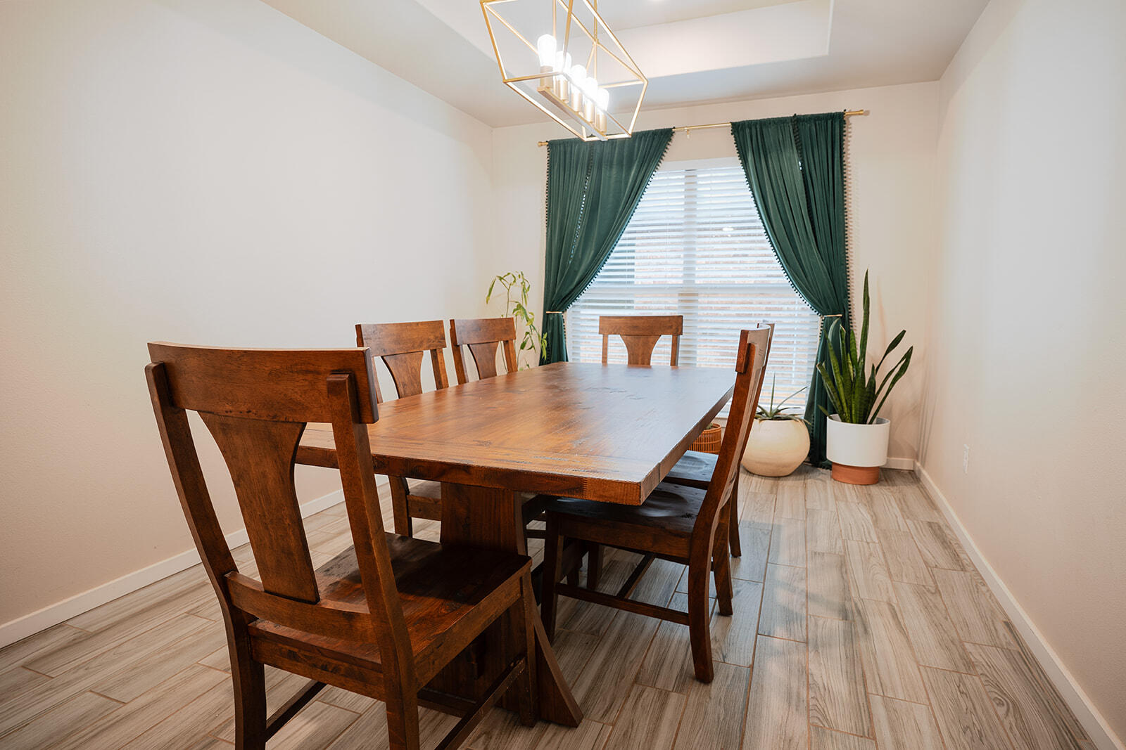 1927 142nd Street Lubbock, TX 79423 - Photo 29 of 58 a view of a dining room with furniture and wooden floor