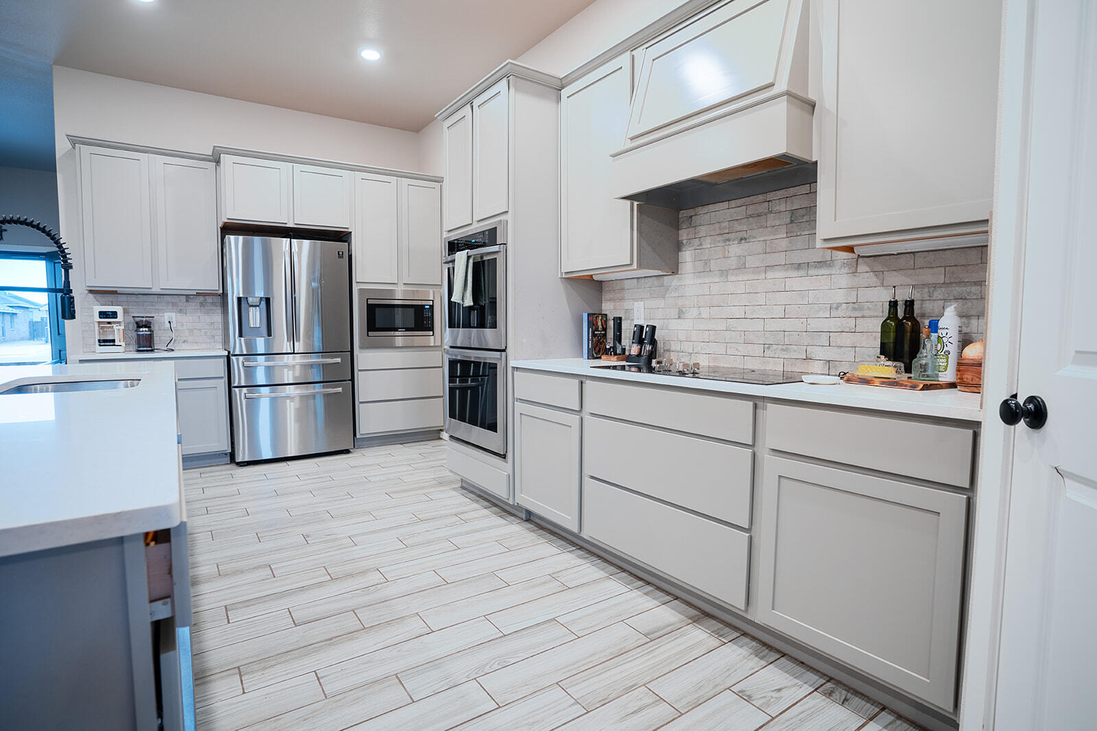 1927 142nd Street Lubbock, TX 79423 - Photo 33 of 58 a kitchen with stainless steel appliances a refrigerator sink and cabinets