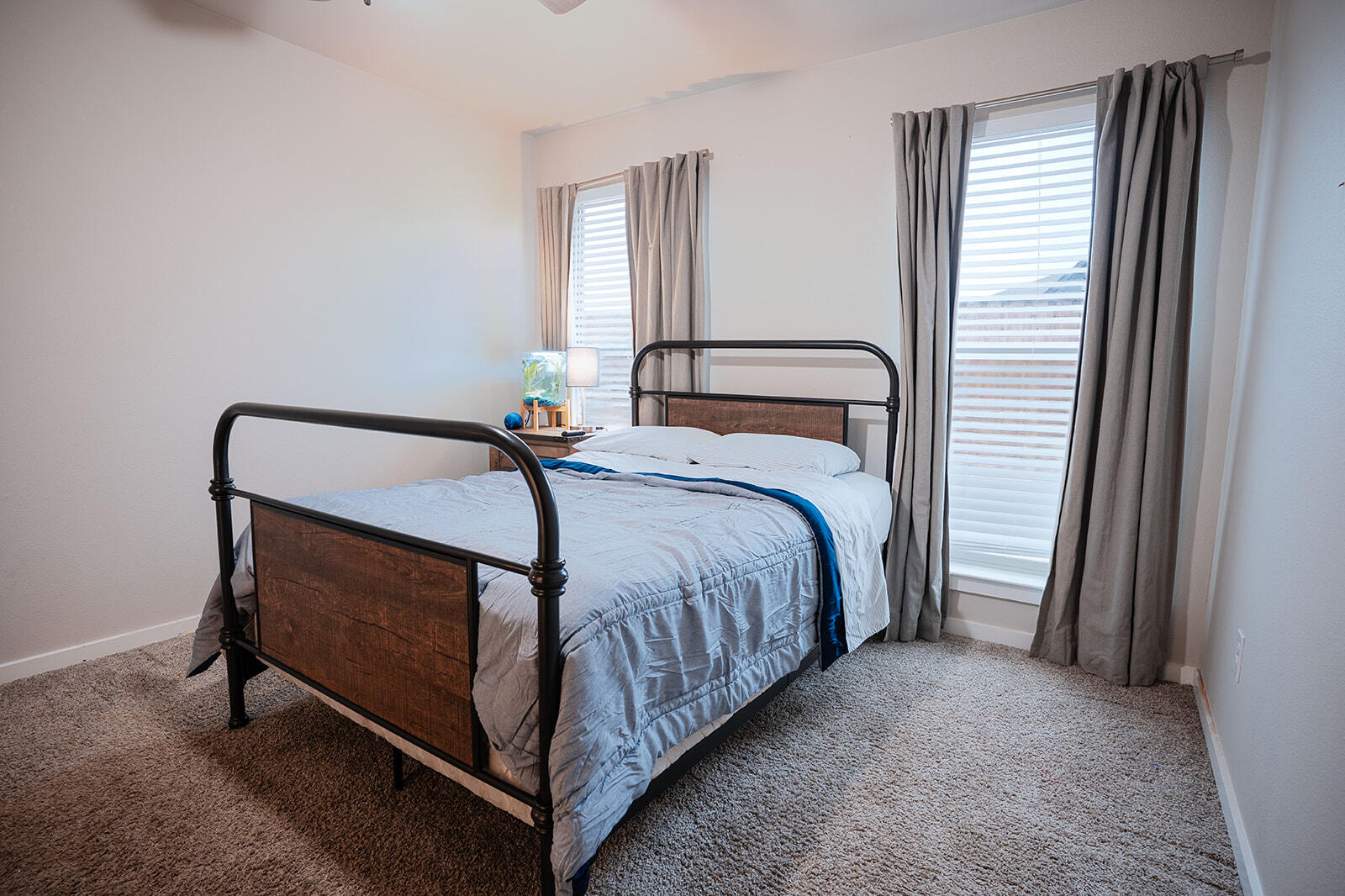 1927 142nd Street Lubbock, TX 79423 - Photo 37 of 58 a bed sitting in a bedroom next to a window