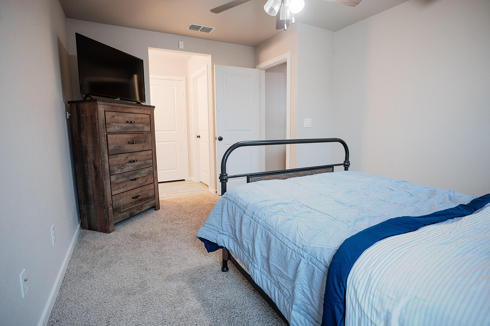 1927 142nd Street Lubbock, TX 79423 - Photo 38 of 58 a bedroom with a bed and a television