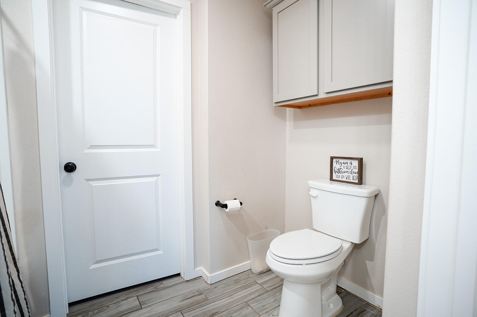 1927 142nd Street Lubbock, TX 79423 - Photo 40 of 58 a bathroom with a toilet and a sink