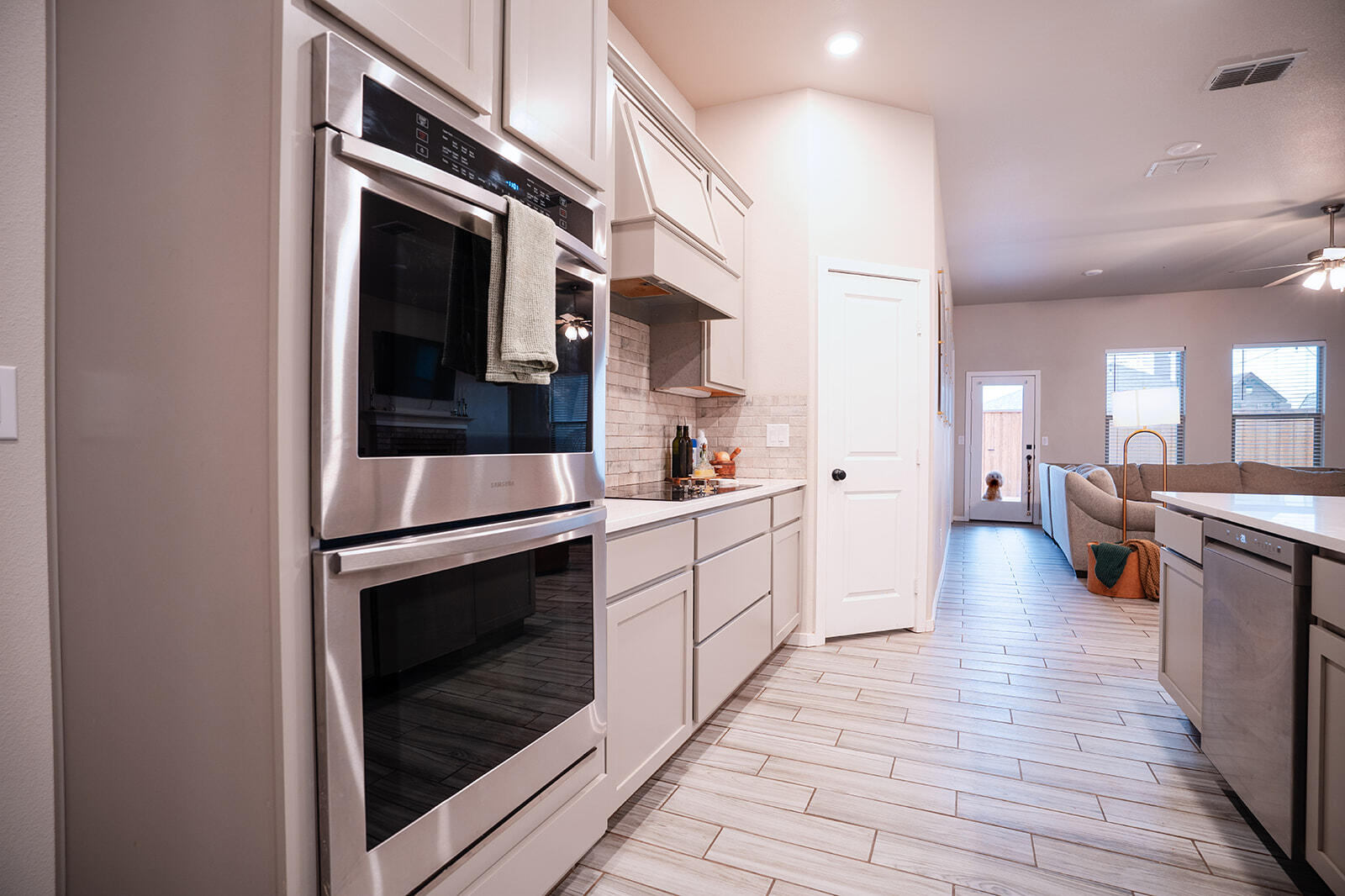 1927 142nd Street Lubbock, TX 79423 - Photo 48 of 58 a kitchen with stainless steel appliances a stove microwave and cabinets