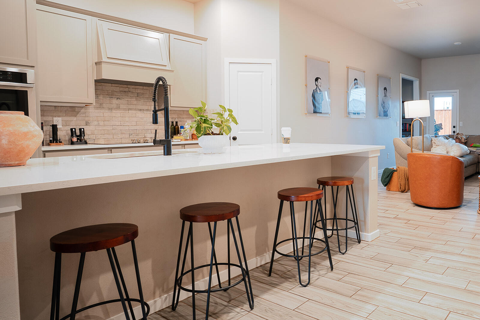 1927 142nd Street Lubbock, TX 79423 - Photo 50 of 58 a kitchen with stainless steel appliances a table chairs and a wooden floor